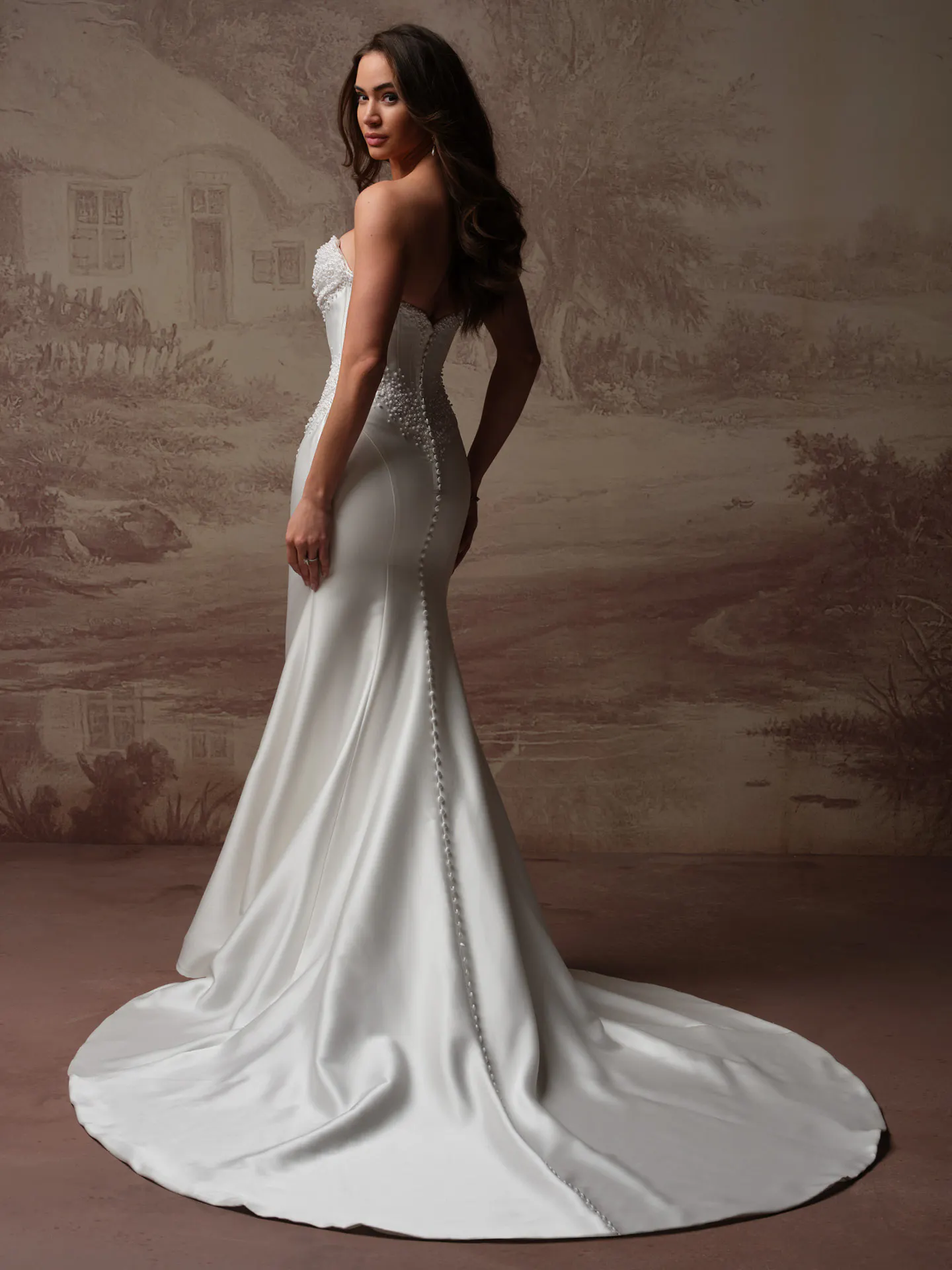 Maggie Sottero Melissa back view satin mermaid bridal dress with pearl detail.