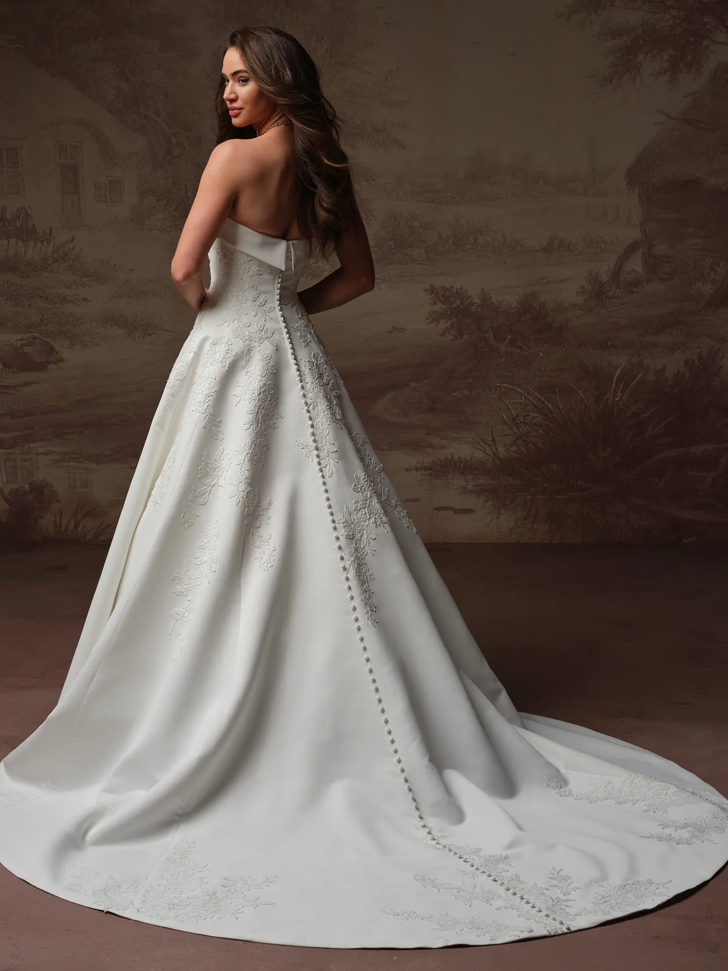 Maggie Sottero Mileva A-Line back view with lace and button detail.