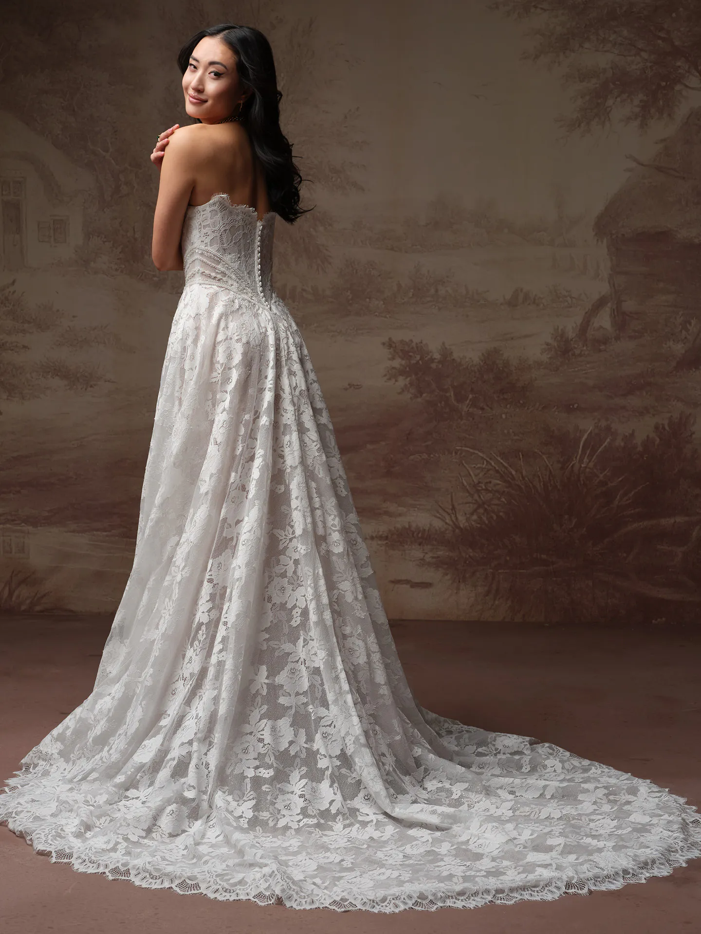 Mischa floral wedding dress with long sheer train, back view.