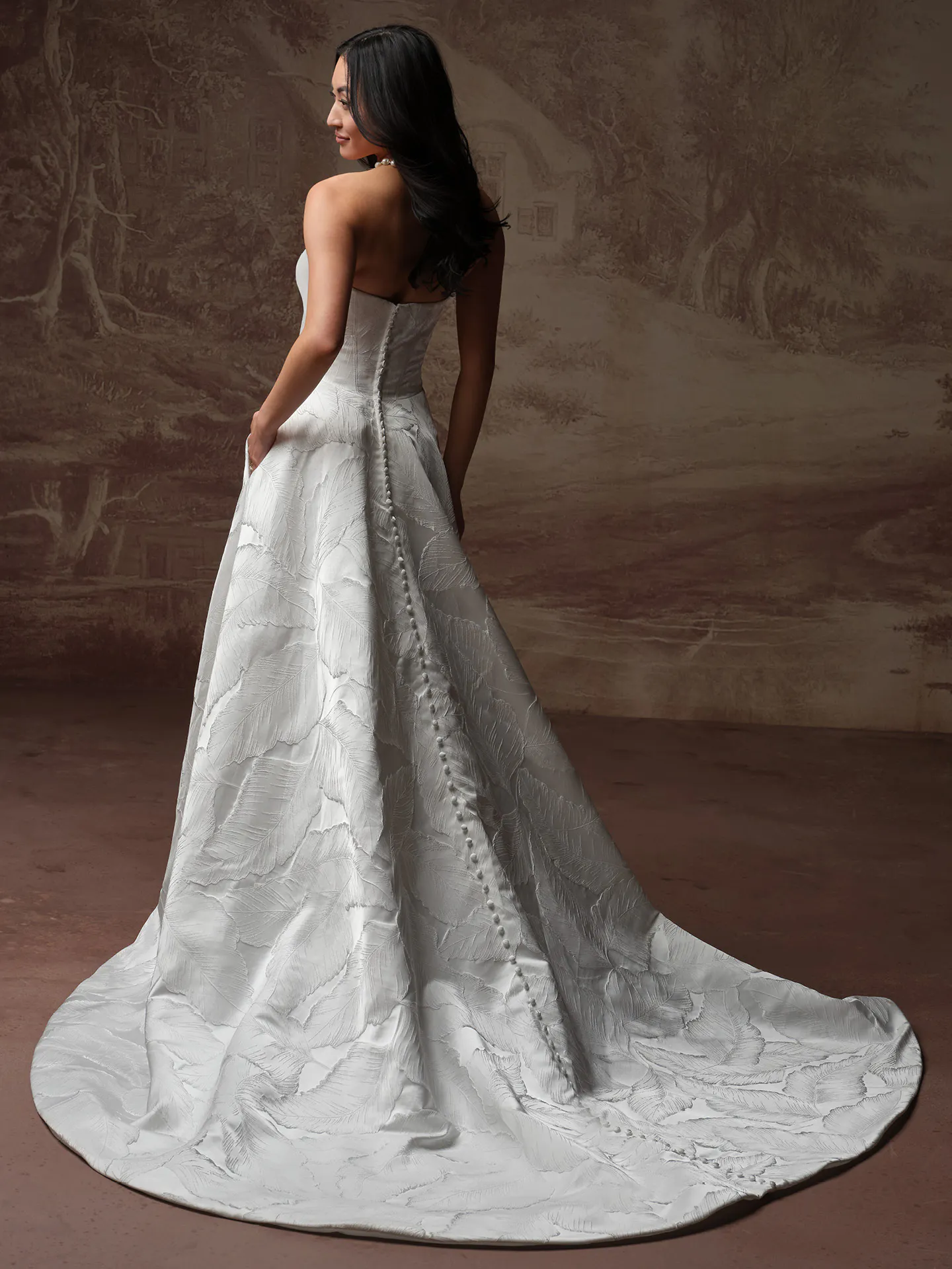 Maggie Sottero Morganna back view wedding dress with jacquard draped train.