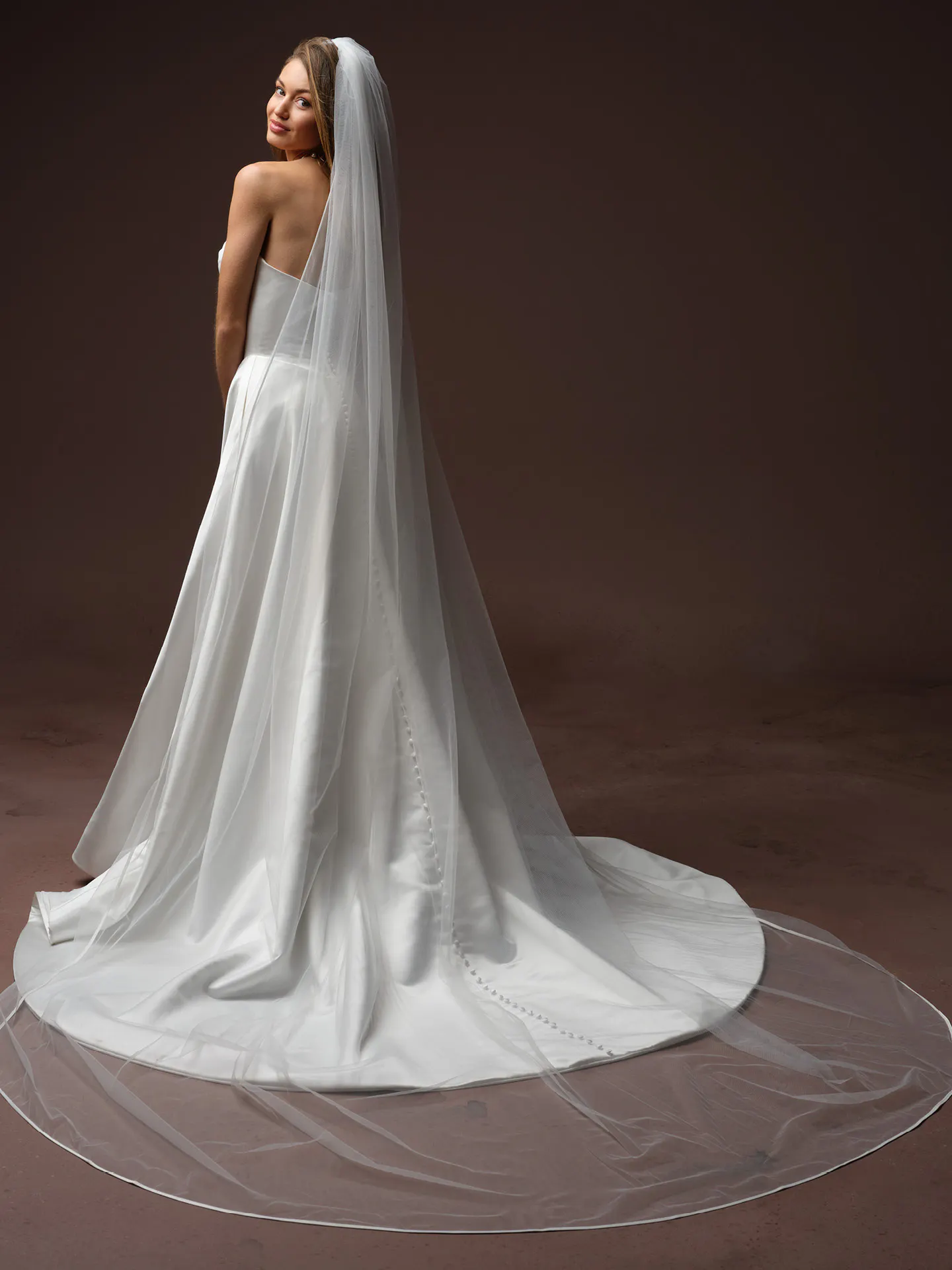 Maggie Sottero Morganna back view satin A Line wedding dress with veil.