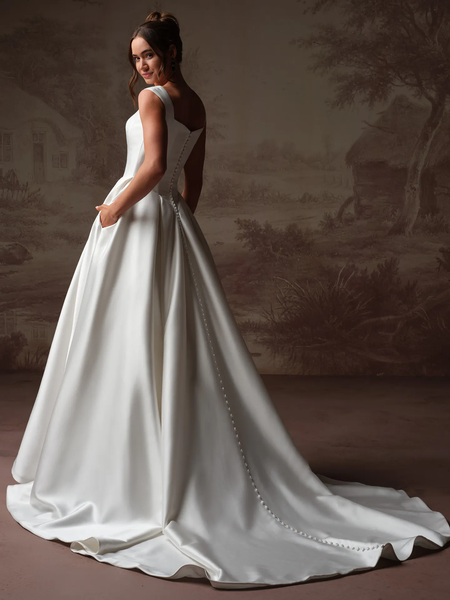 Maggie Sottero Pierce back view satin wedding dress with square neckline and buttons down the train.