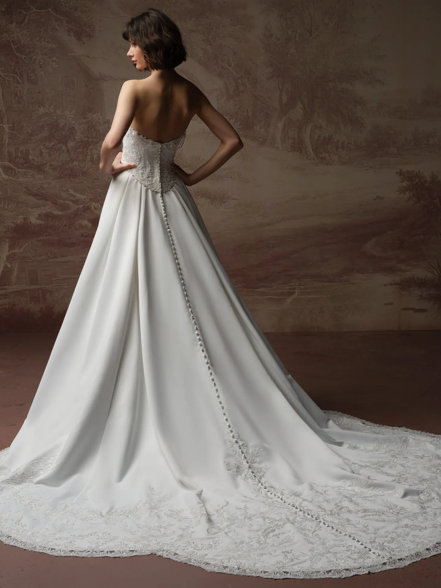 Maggie Sottero Seattle back view satin A-line dress with pearl details.