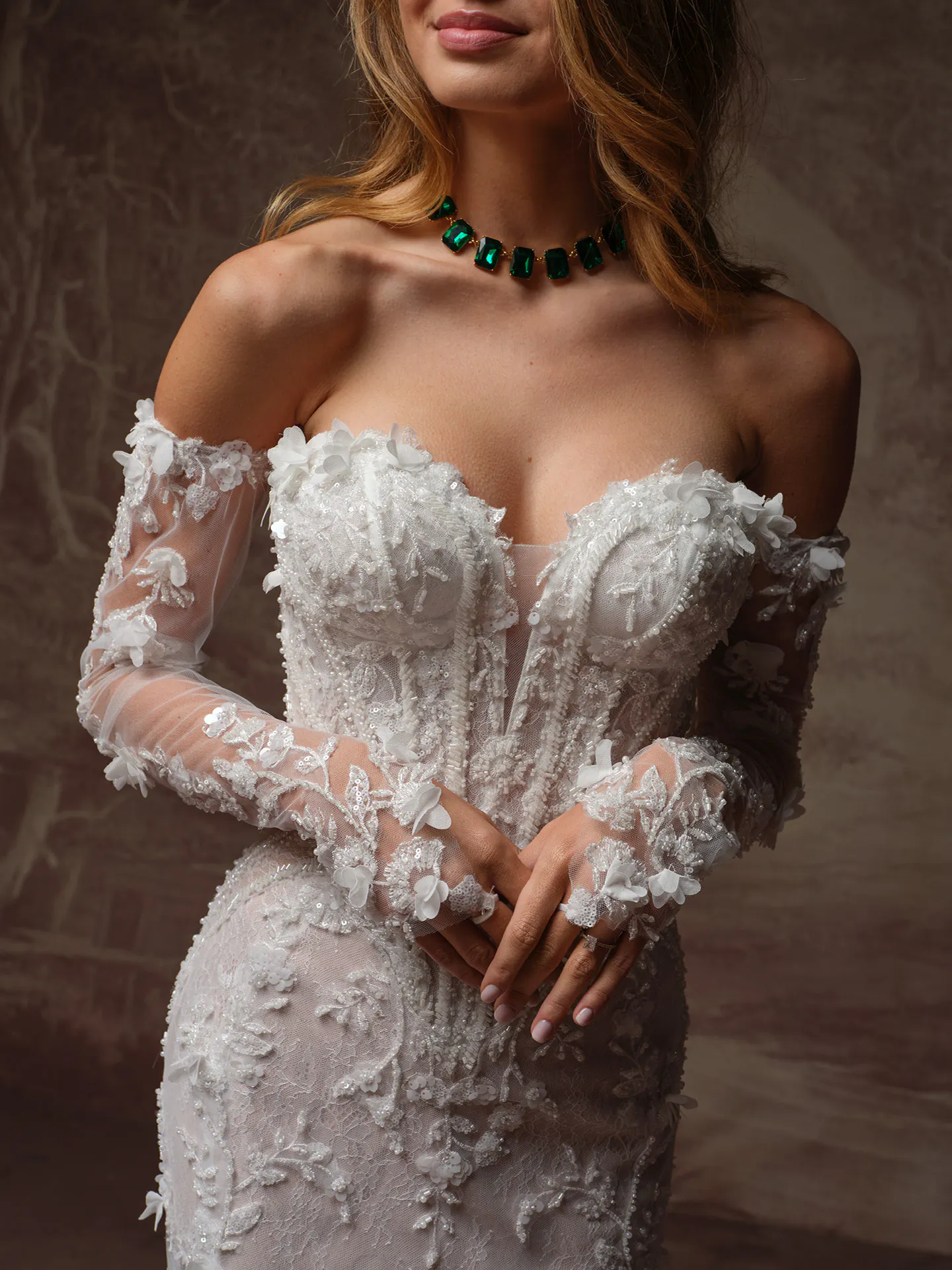 Maggie Sottero Stasia fit-and-flare wedding dress with sheer long sleeves
