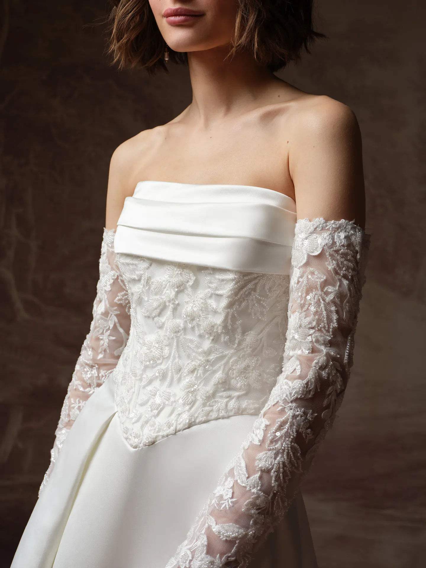 Maggie Sottero Wisteria front view lace bodice basque waist wedding dress with sleeves.