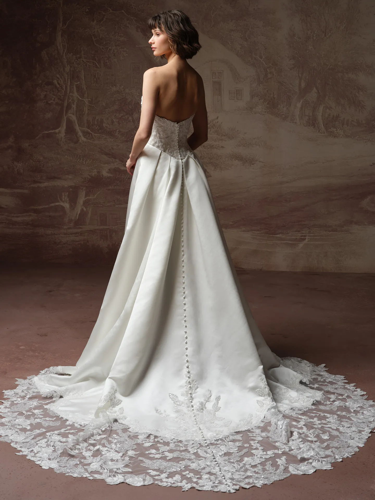 Maggie Sottero Wisteria back view lace bodice and basque waist wedding dress.
