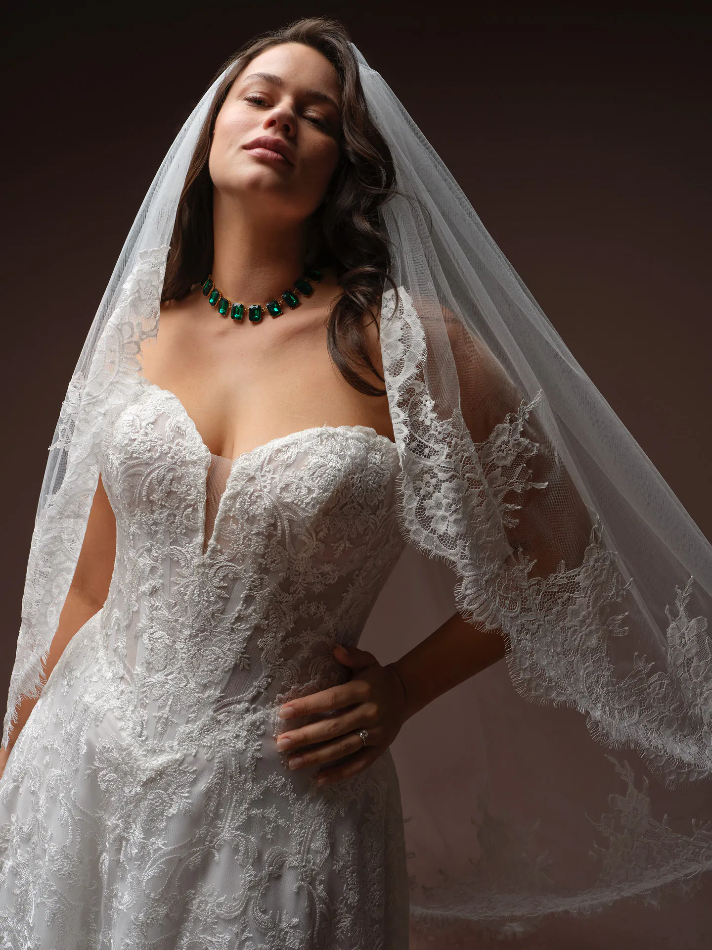 Zahia lace basque waist v-neck wedding dress front view Maggie Sottero.