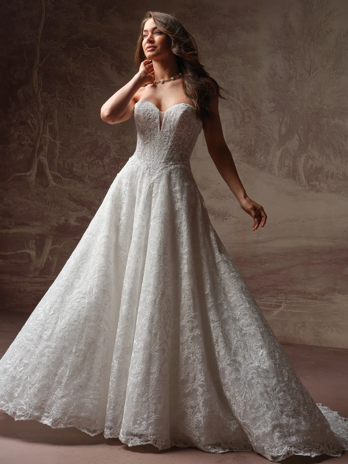 Maggie Sottero Zahia front view lace basque waist V-neck wedding dress.