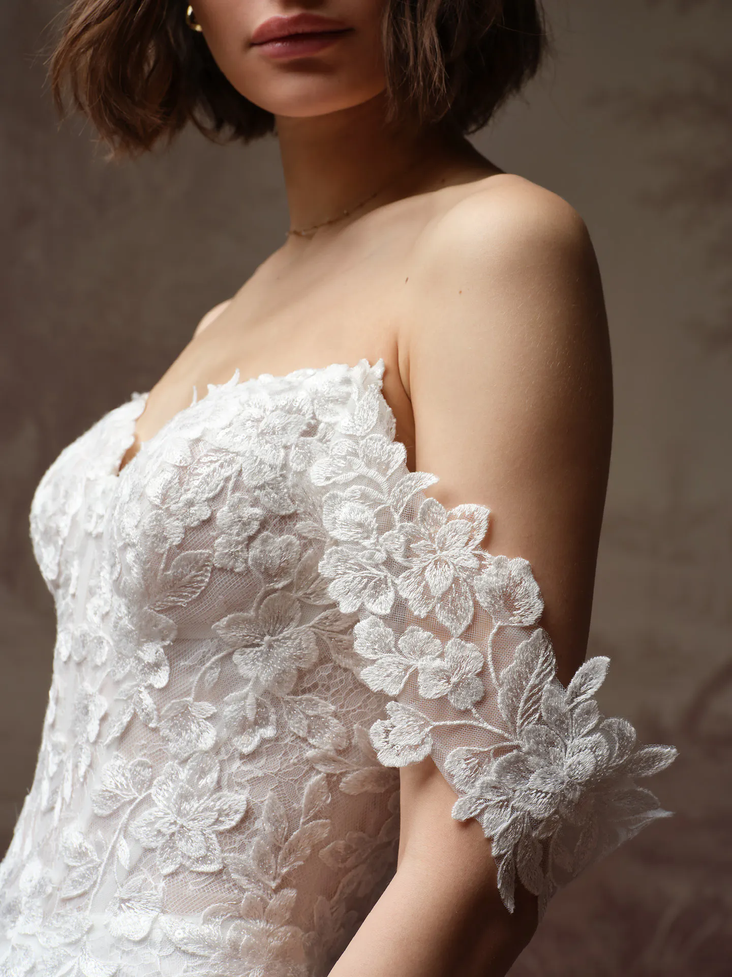 Rebecca Ingram Brandy, side view with floral lace detailing.
