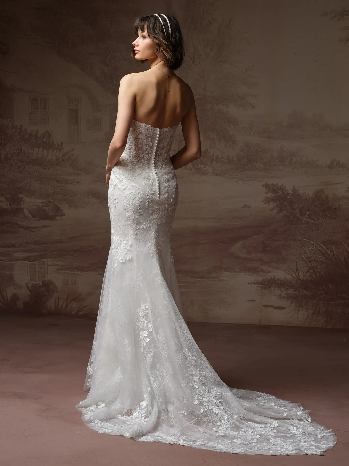 Rebecca Ingram Brandy fit-and-flare wedding dress back view with flowing skirt.