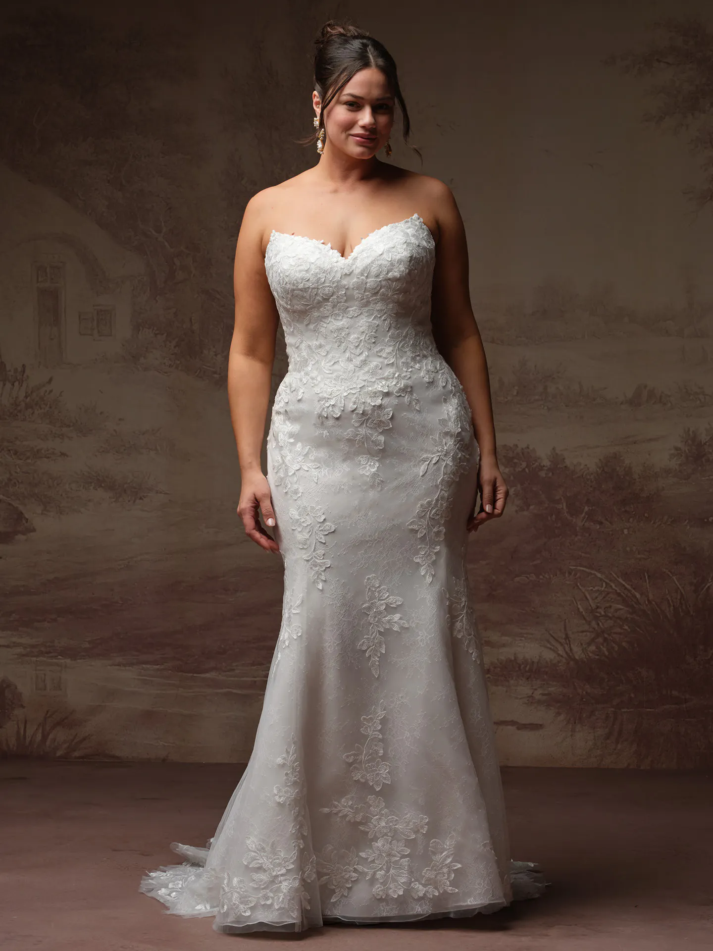 Rebecca Ingram Brandy fit-and-flare wedding dress with floral accents, front view.