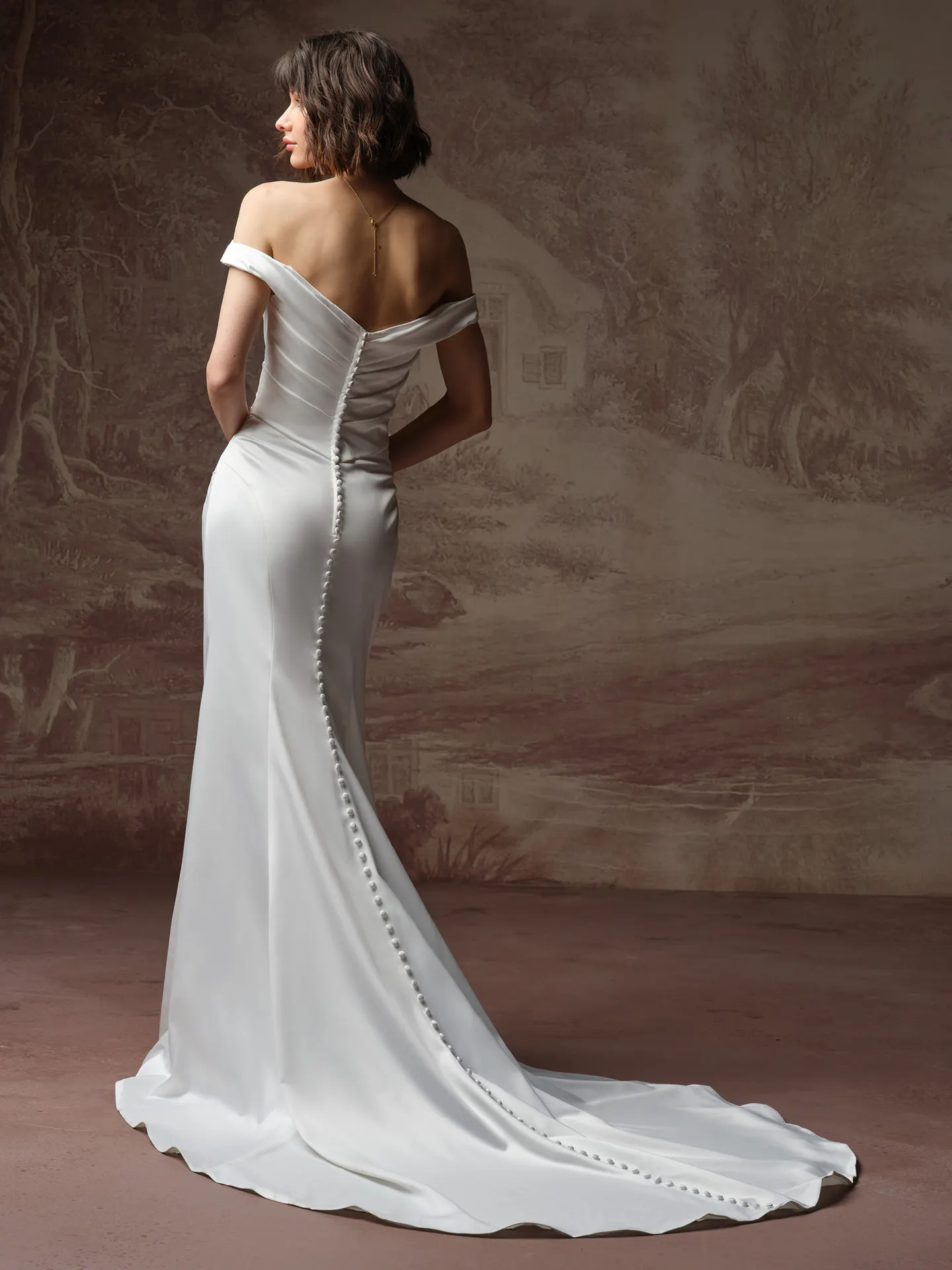 Rebecca Ingram Clementine, back view off-the-shoulder wedding dress with button detail.