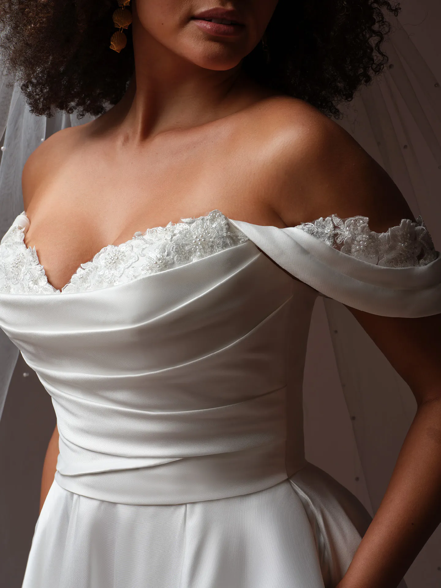 Rebecca Ingram Daphne draped bodice off-shoulder lace A-Line wedding dress, front view.