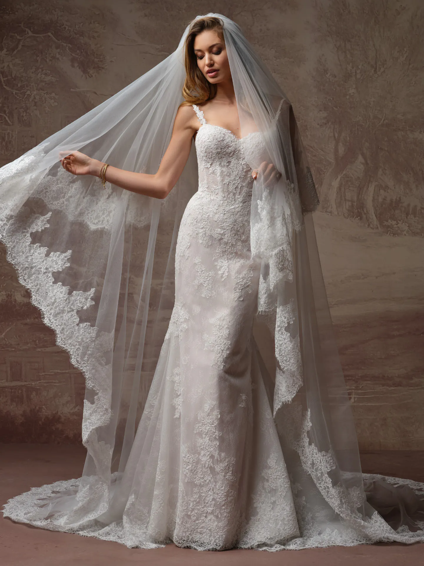 Rebecca Ingram Esmeralda, front view lace fit-and-flare wedding dress with veil.