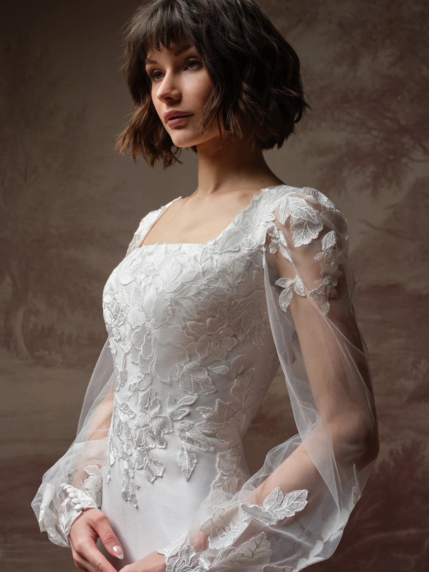 Rebecca Ingram Goldie Leigh, side view lace wedding dress with square neck and long sleeves.