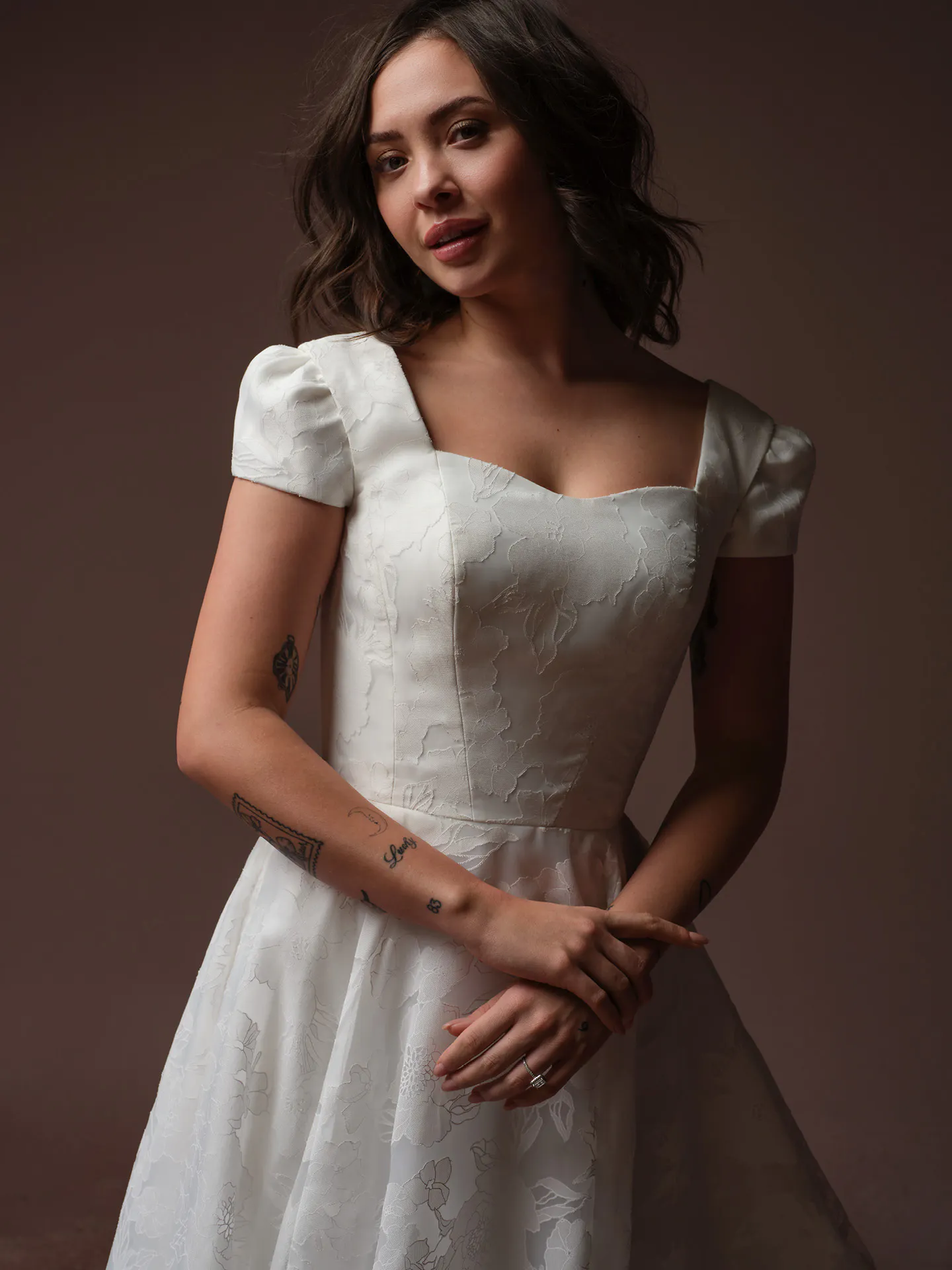 Rebecca Ingram Jade, front view scoop neck wedding dress with floral organza pattern.
