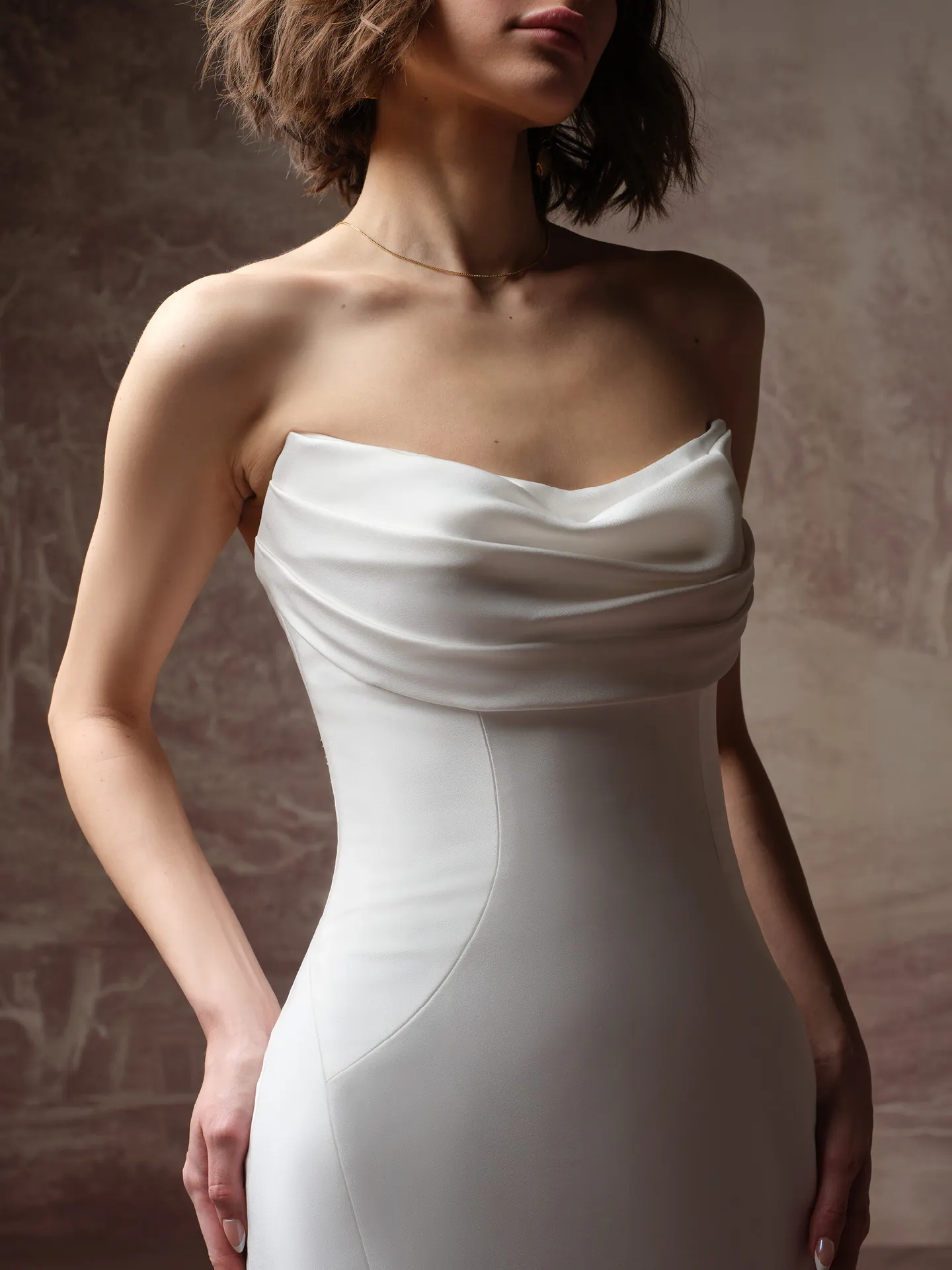 Rebecca Ingram Kayla draped bodice strapless sheath wedding dress, front view.