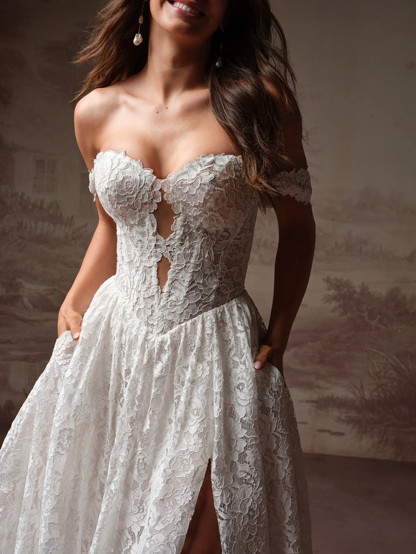 Rebecca Ingram Narelle lace plunging neckline wedding dress, front view.