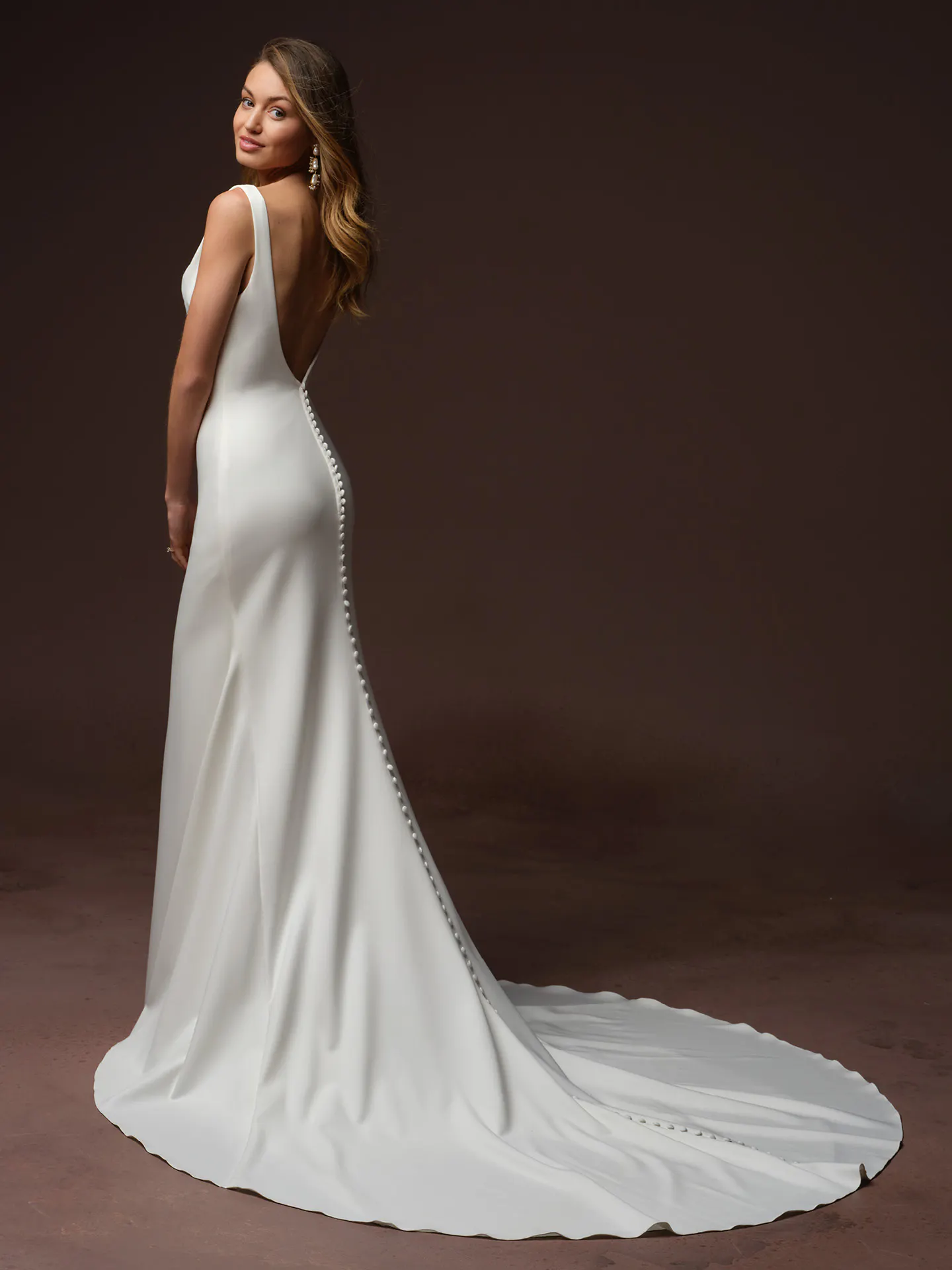 Rebecca Ingram Tiana, back view satin fit-and-flare dress with button detail.