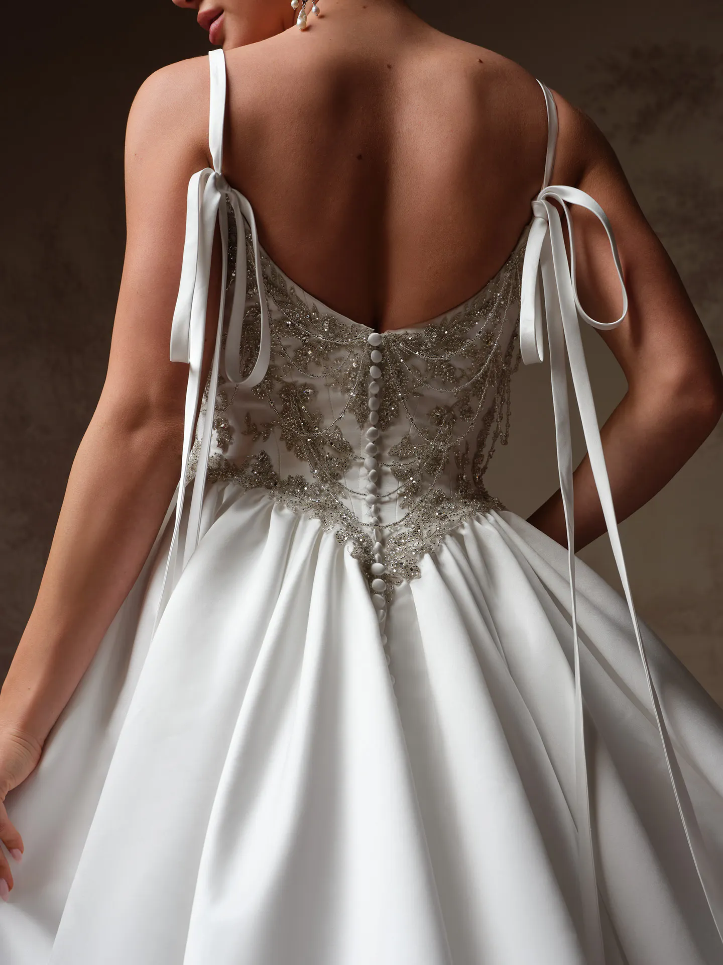 Sottero and Midgley Aelarion back view with beaded bodice and satin fabric.