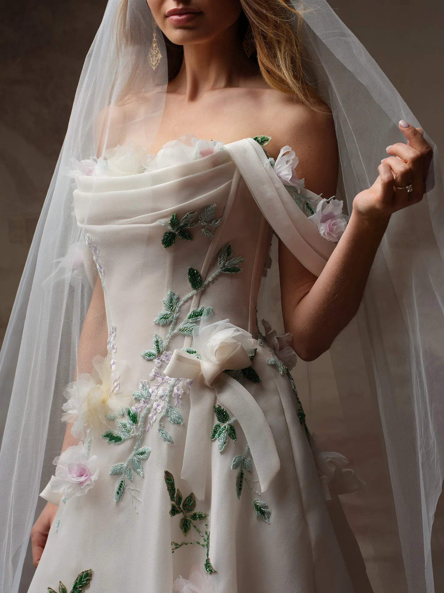 Sottero and Midgley Amaryllis dress with 3D floral details and bow, front view.
