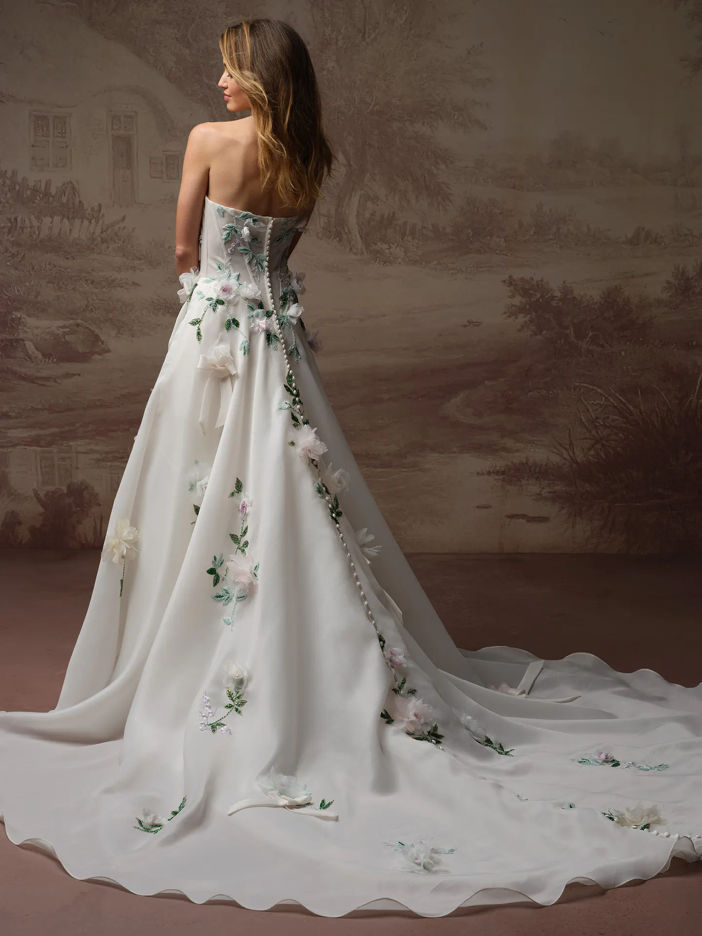 Sottero and Midgley Amaryllis back view 3 D floral dress with scattered bows.