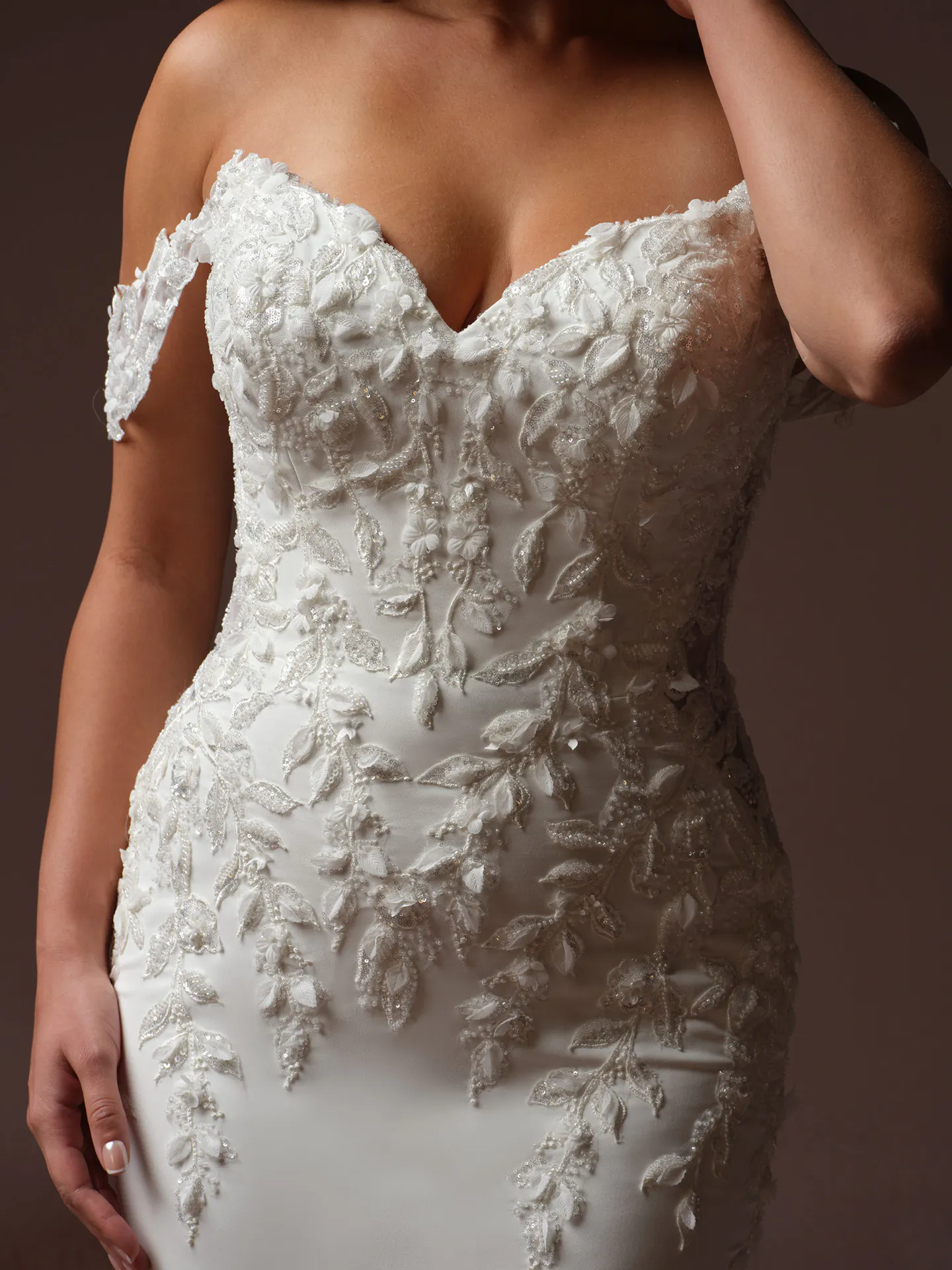 Sottero and Midgley Blair front view lace fit-and flare dress with 3 D floral details.