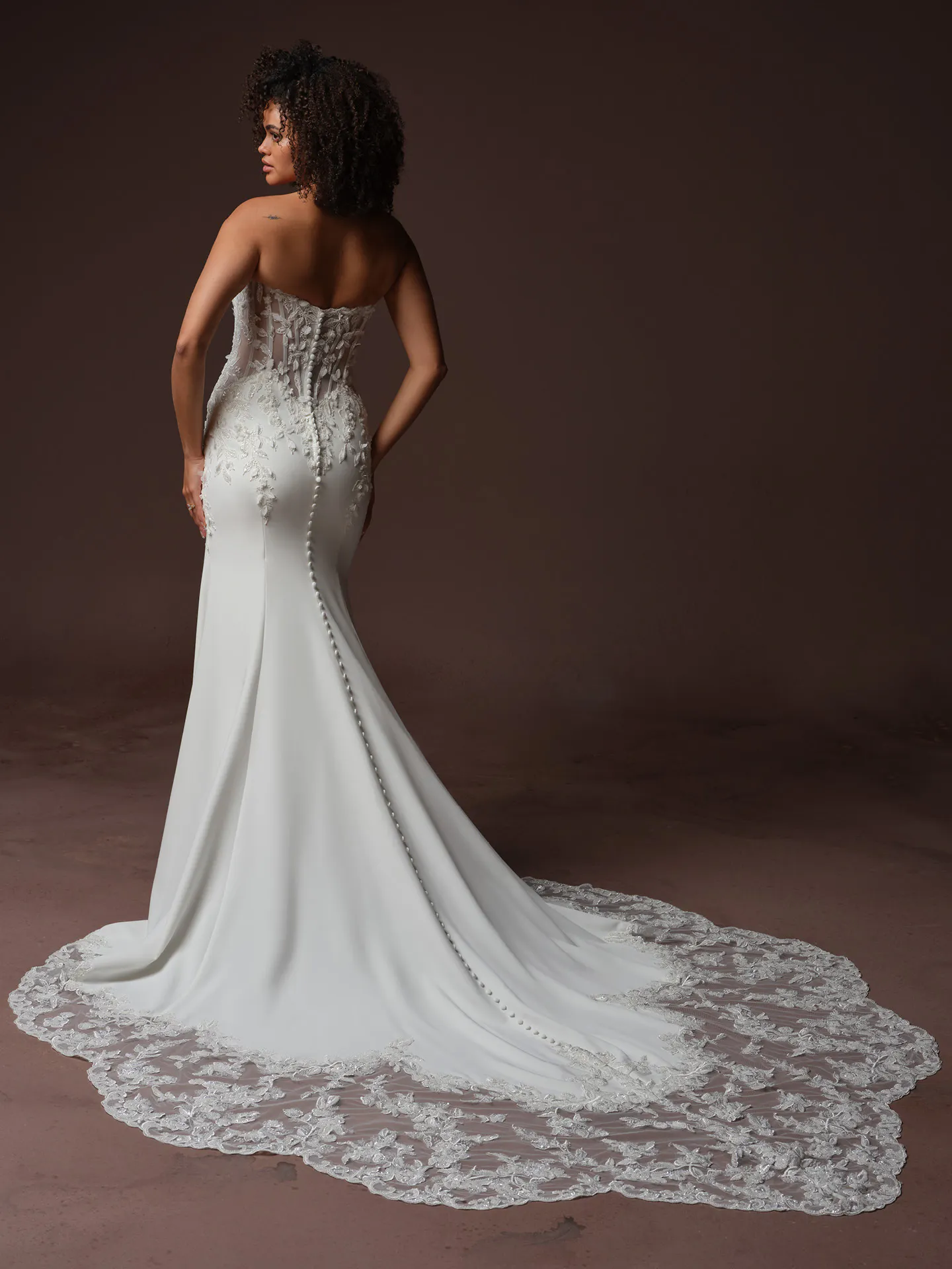 Sottero and Midgley Blair back view lace fit-and flare wedding dress with long train.