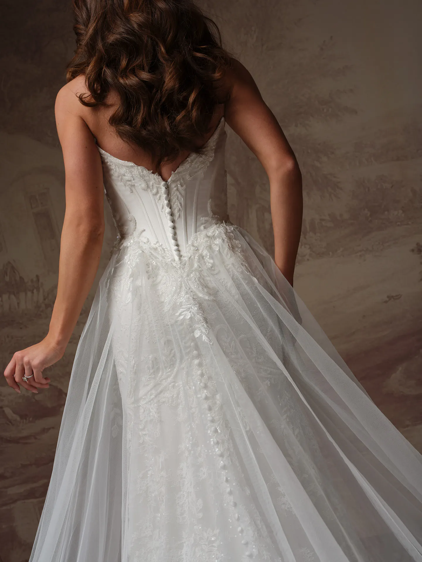 Sottero and Midgley Eirawen, back view fit-and-flare lace wedding dress.