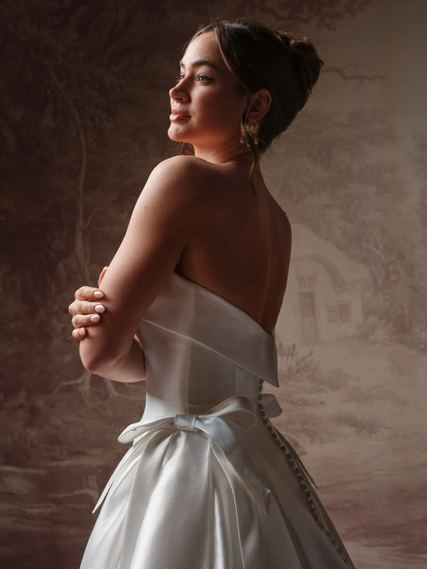 Sottero and Midgley Gemma, side view satin ballgown with bow.
