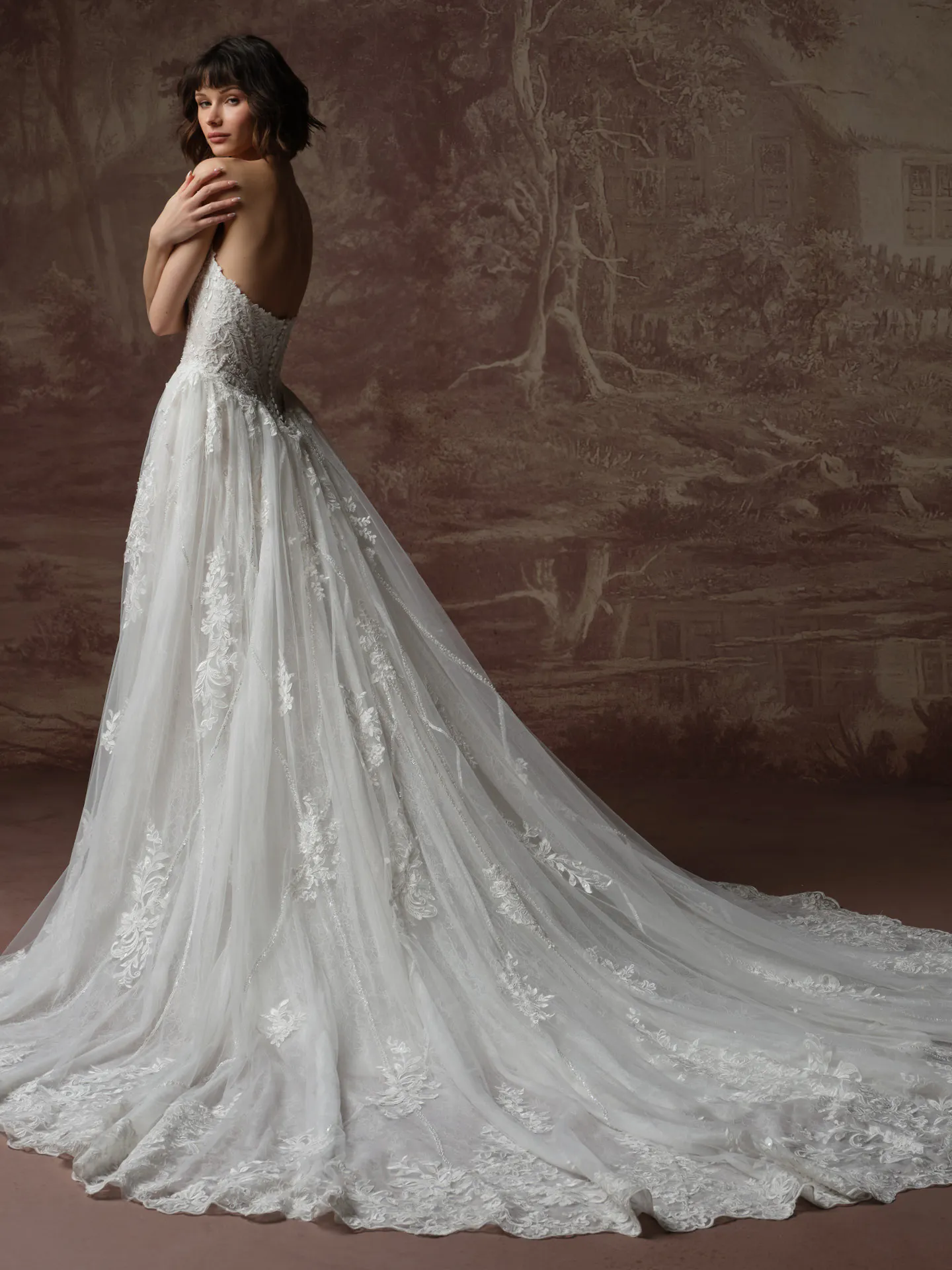 Sottero and Midgley Hester, back view with sequined lace bodice and flowing train.