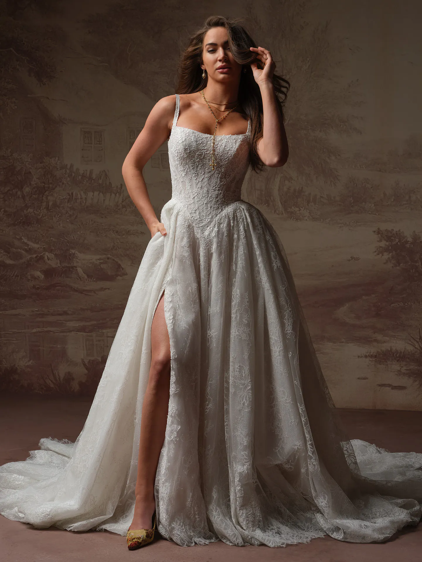 Sottero and Midgley Ivandra, front view lace ballgown with slit and straps.