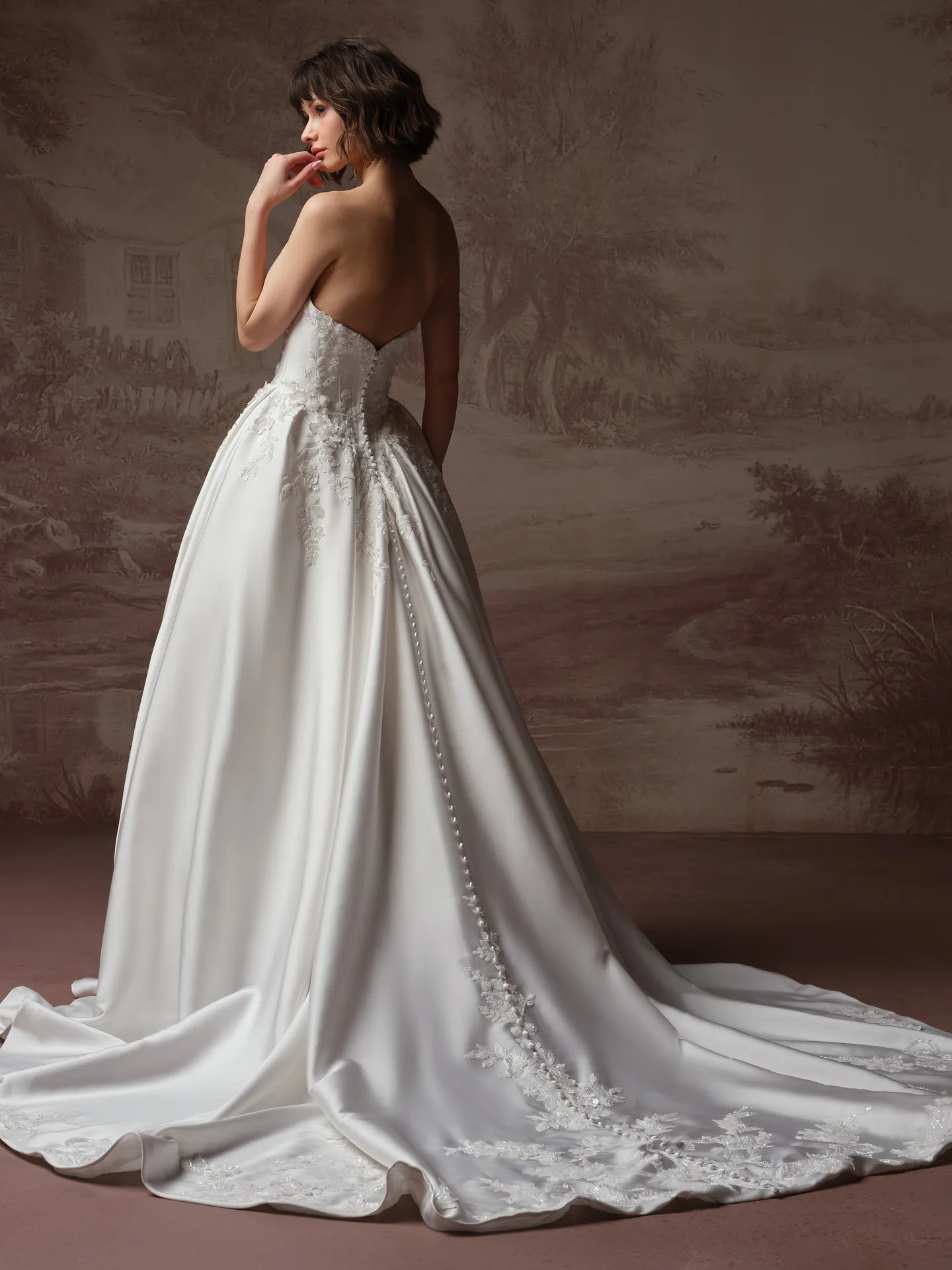 Sottero and Midgley Petra, back view beaded lace wedding dress with long train.