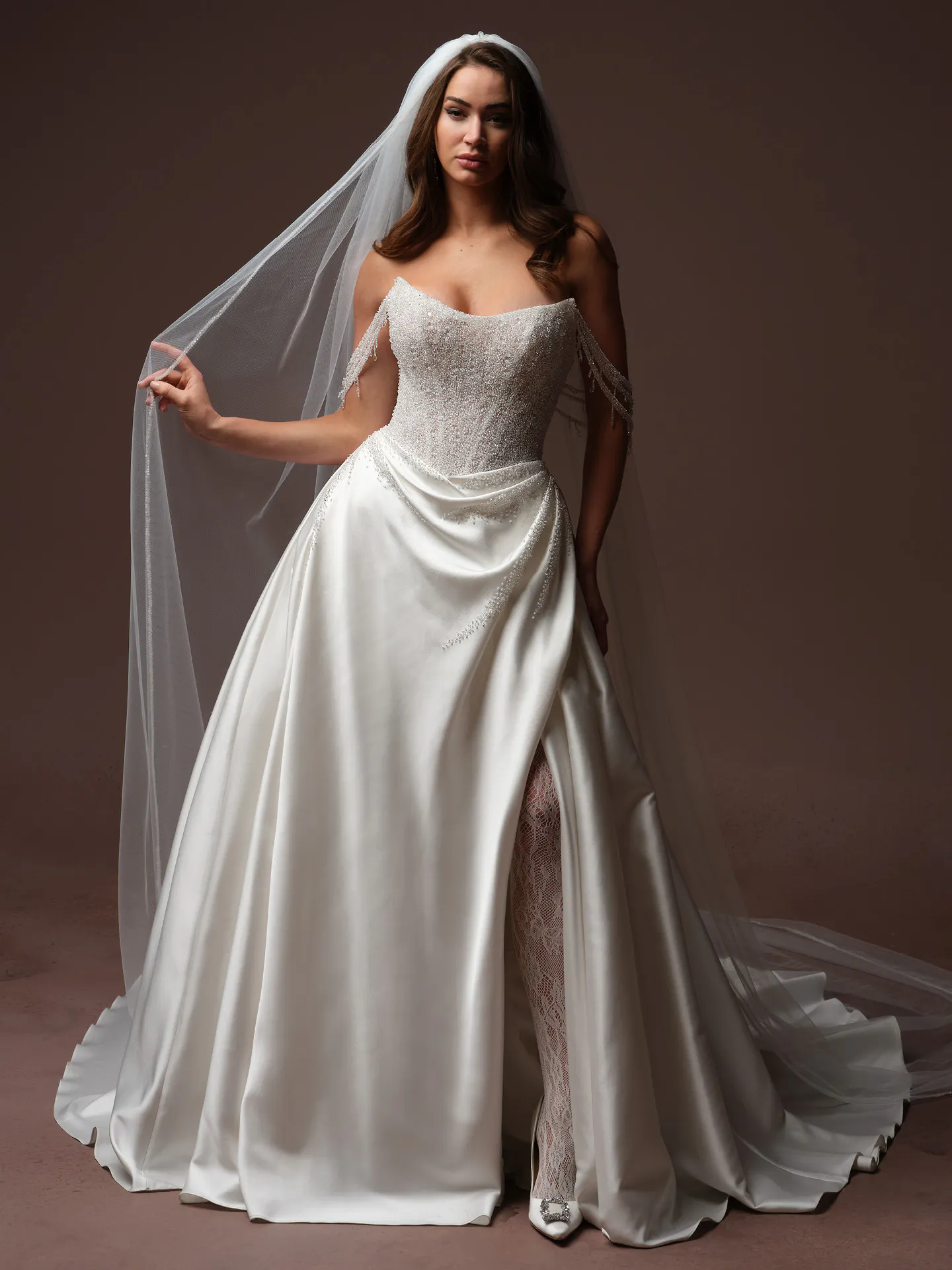 Sottero and Midgley Rumi, front view beaded bodice ballgown with veil.