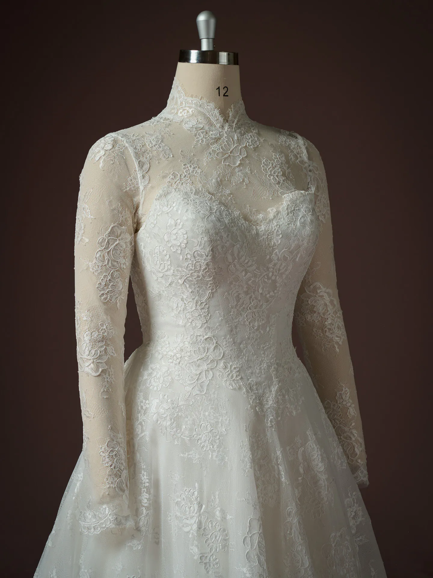 Sottero and Midgley Vespera lace long sleeve A-line dress, front view.