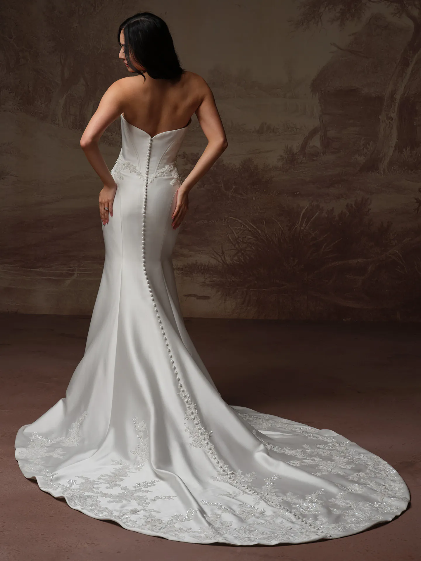 Sottero and Midgley Yadira, back view fit-and-flare satin dress with buttons and beading.