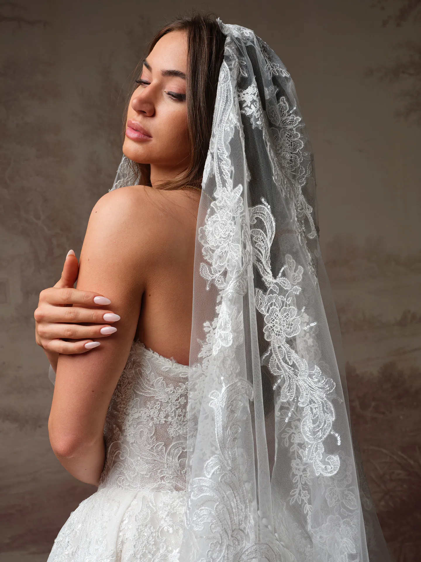 Yesenia sequin lace ballgown wedding dress, back view with veil detail, Sottero and Midgley.
