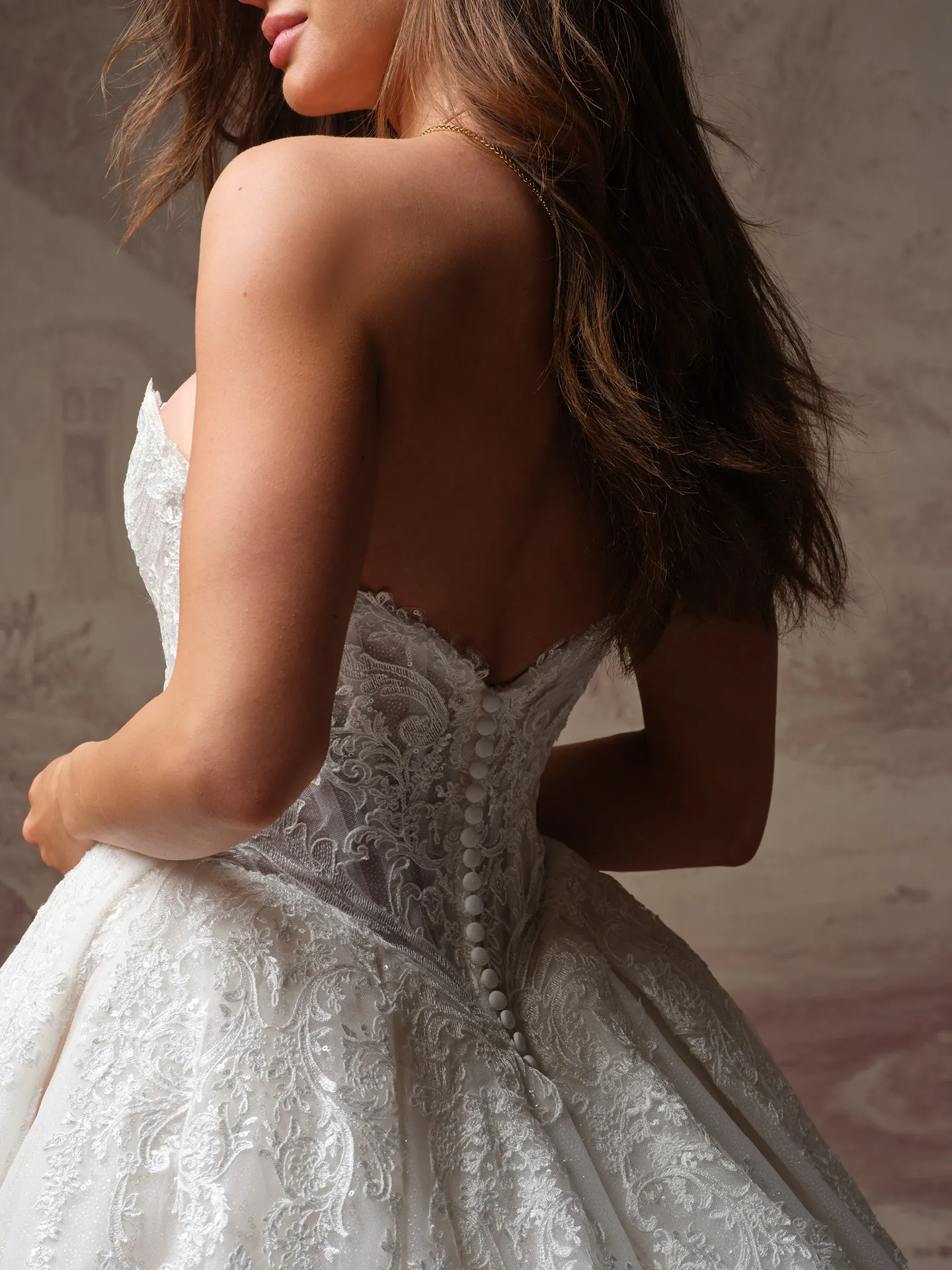 Sottero and Midgley Yesenia, back view lace ballgown with button detail.