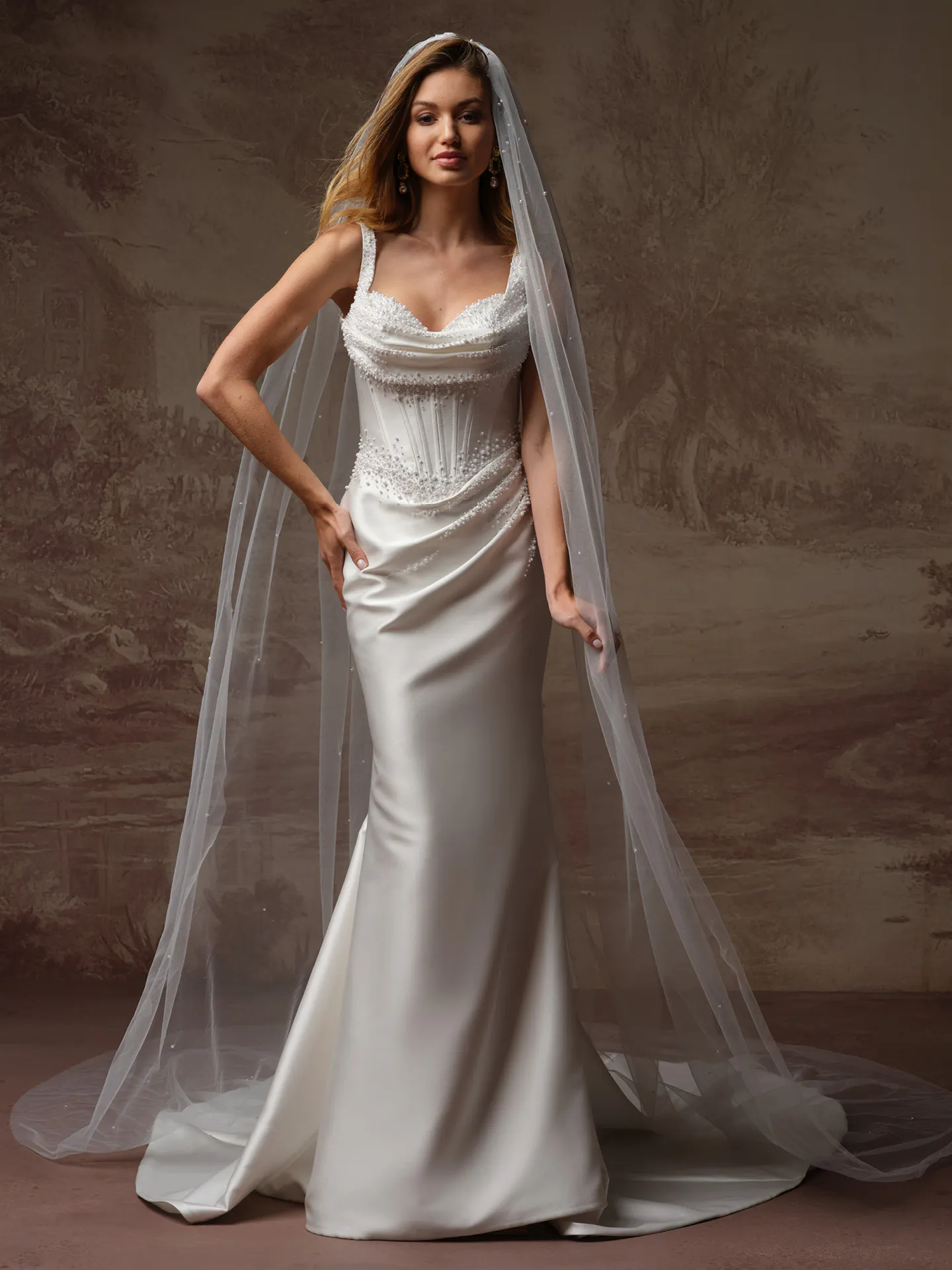 Rebecca Ingram sheath dress front view with beaded bodice and veil.