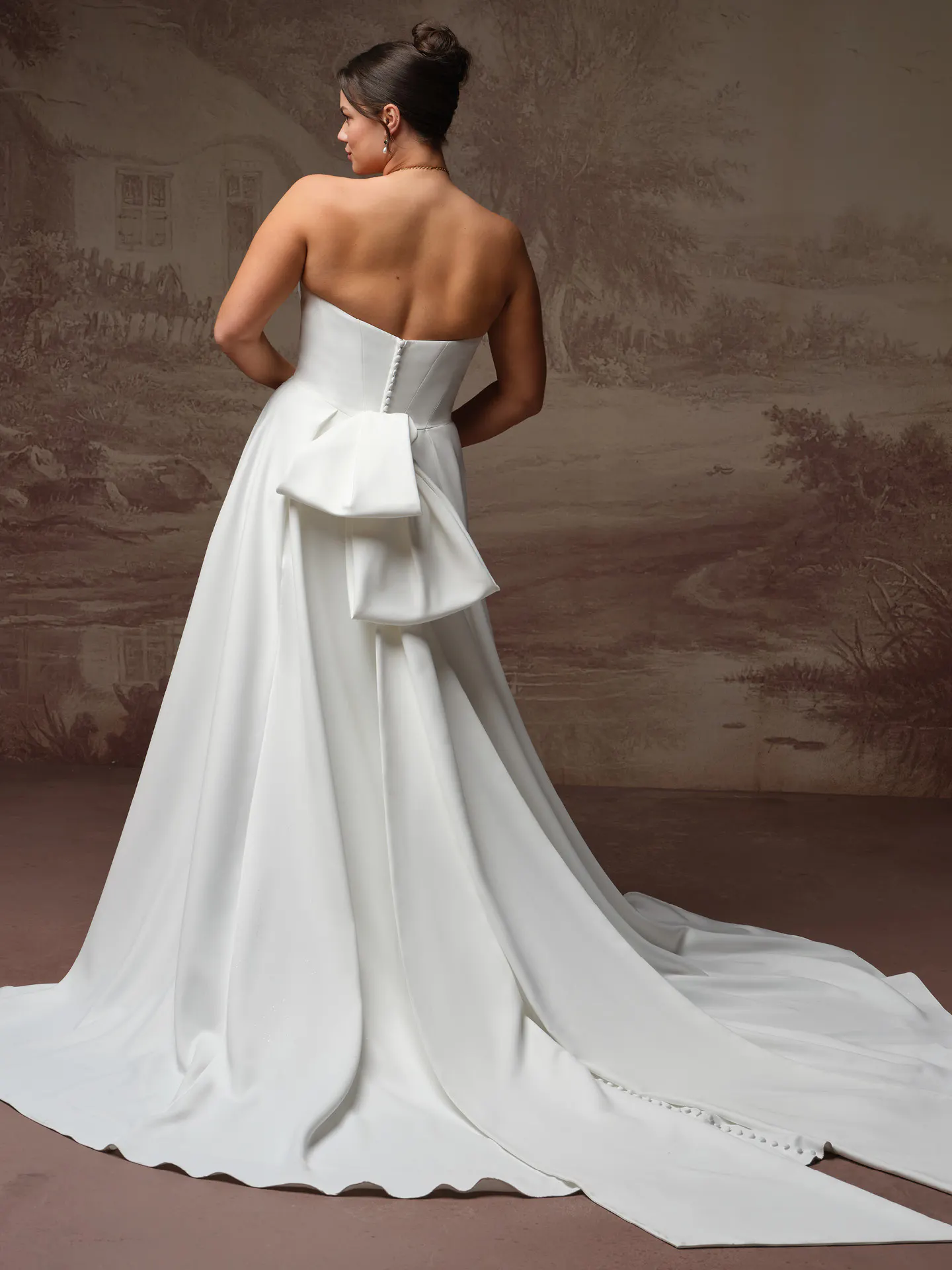 Calliope satin asymmetrical A-line wedding dress back view Maggie Sottero.