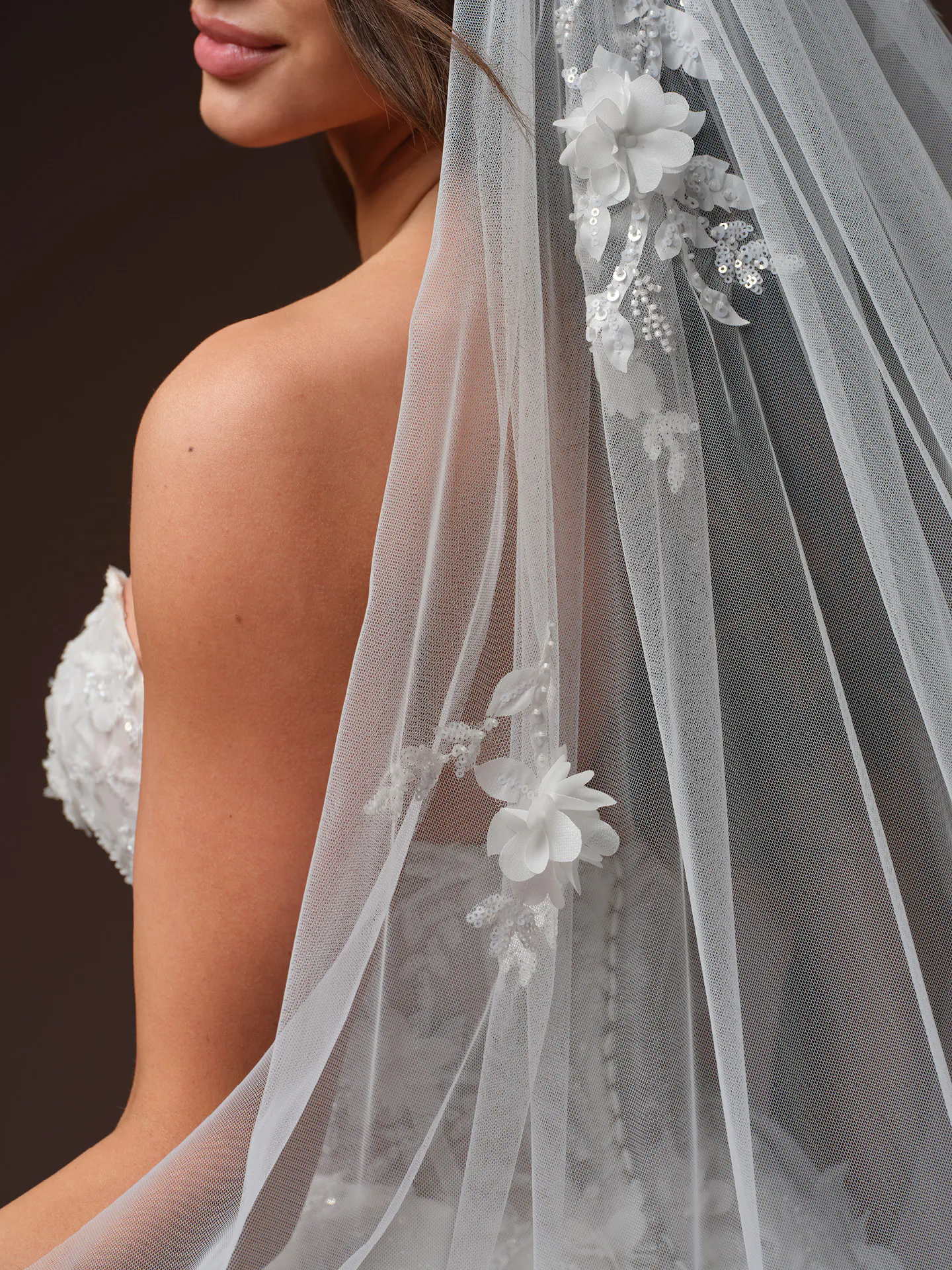 Maggie Sottero Fern floral lace wedding dress side view with veil detail.