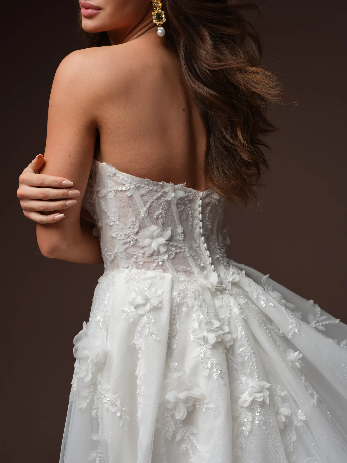 Maggie Sottero Fern back view with 3 D floral lace detailing.