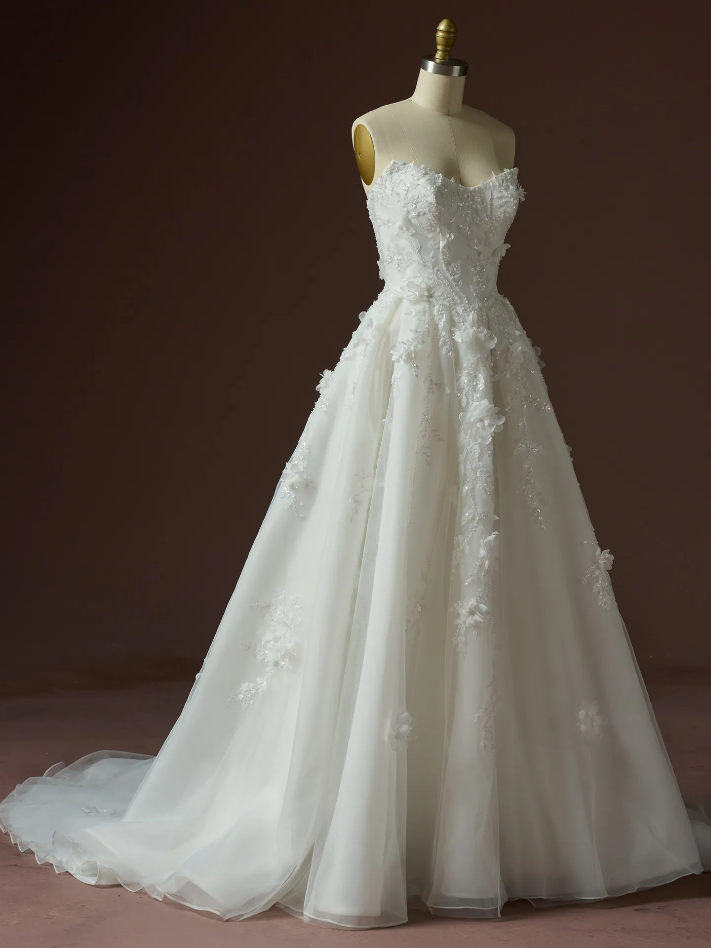 Maggie Sottero Fern floral lace A-line wedding dress on mannequin, front view.
