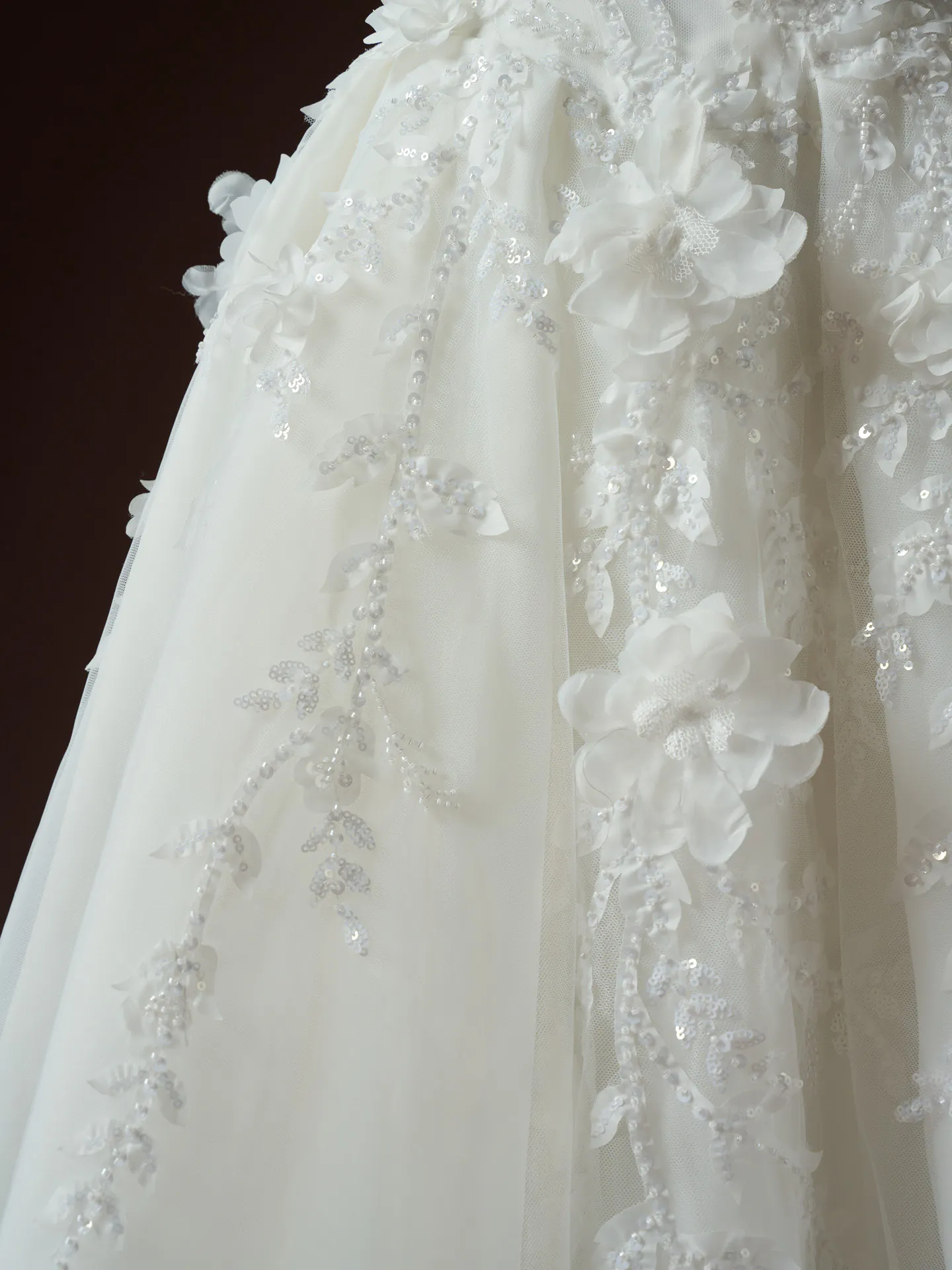 Maggie Sottero Fern floral lace detail on wedding dress fabric.