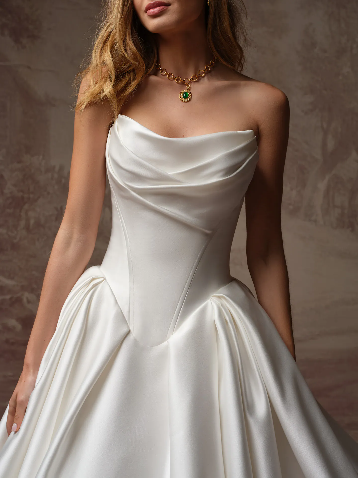 Maggie Sottero Fiorita front view draped bodice with basque waist wedding dress.