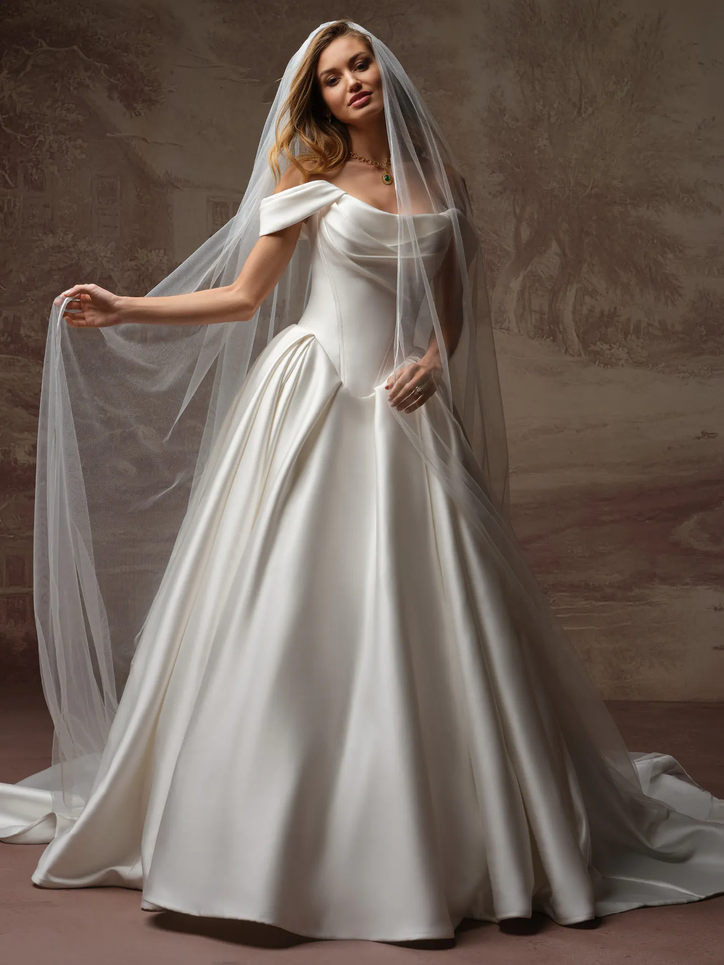 Maggie Sottero Fiorita front view elegant draped bodice wedding dress with veil.