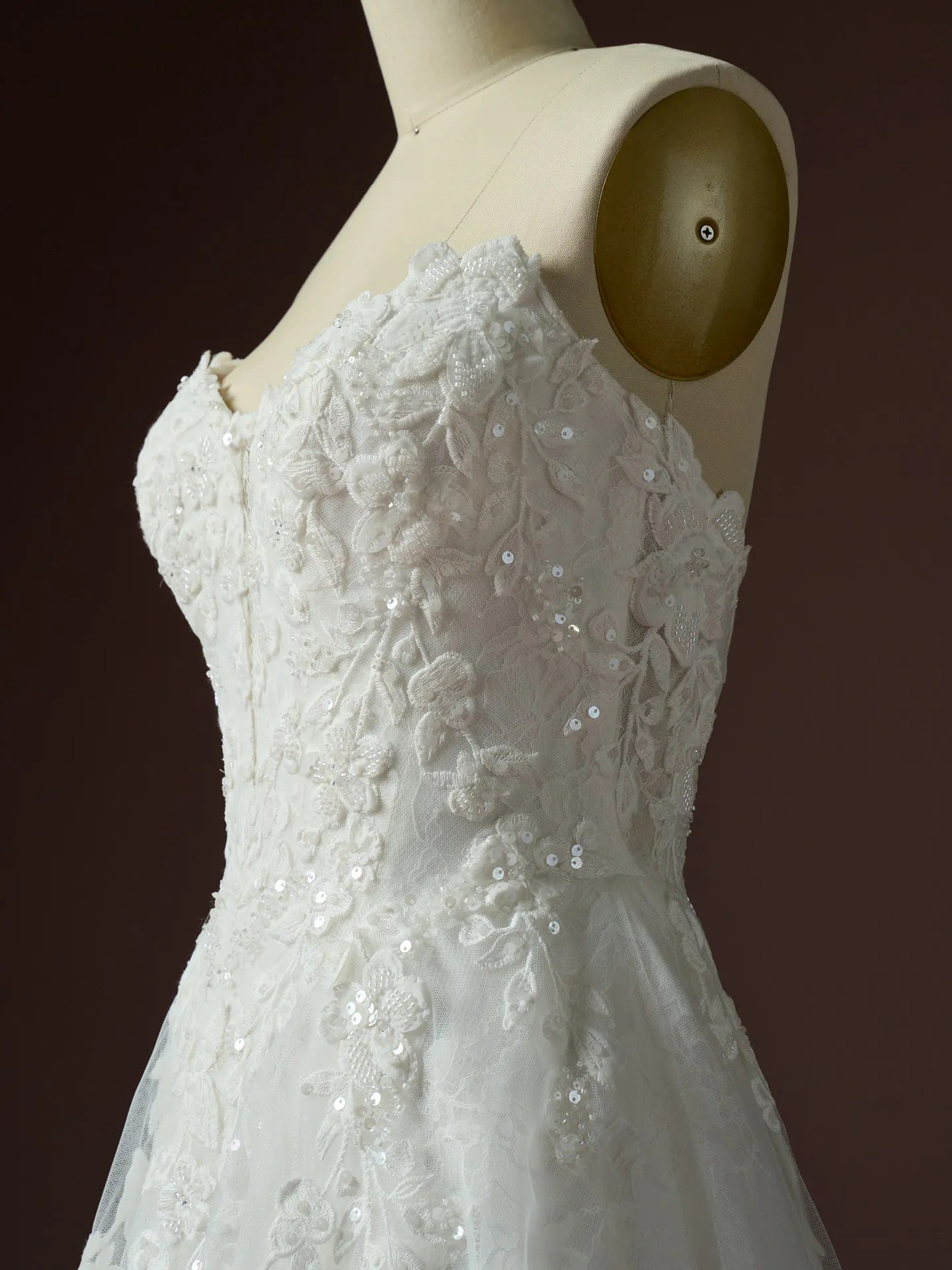 Hadley beaded lace detail on bodice side view Maggie Sottero A Line wedding dress.