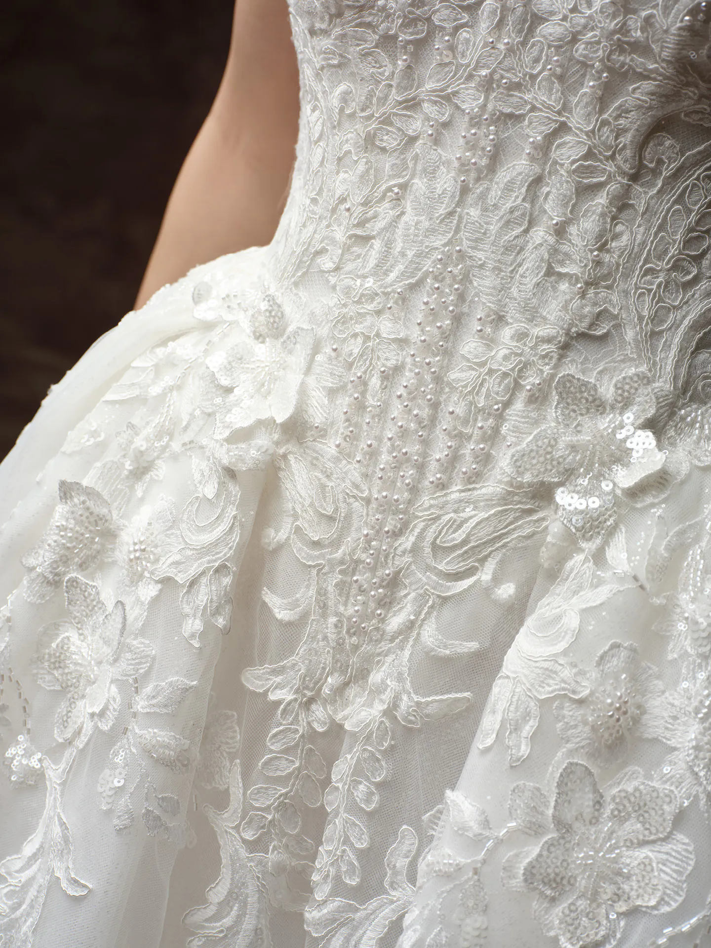 Maggie Sottero Lyra close up, glitter tulle and floral lace details.