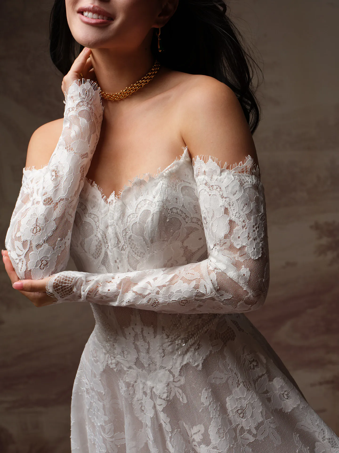 Maggie Sottero Mischa off-shoulder lace A-line wedding dress front view.
