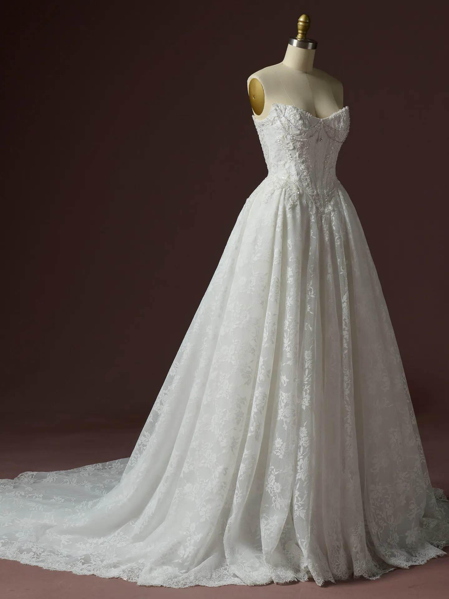 Maggie Sottero Ryland ballgown side view with lace detail.